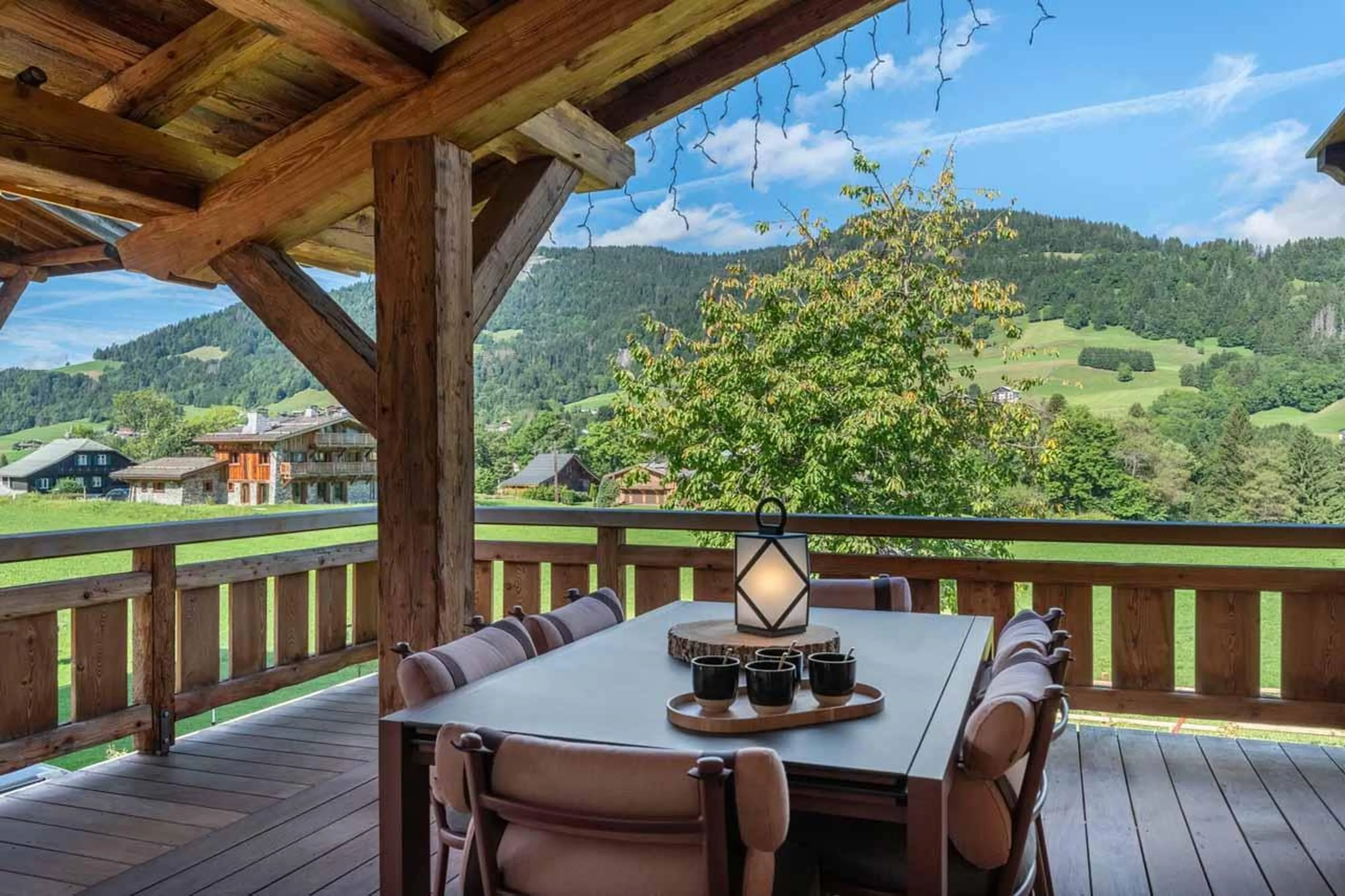 Terrace with outdoor table and mountain views in Chalet Grizzly, Megeve