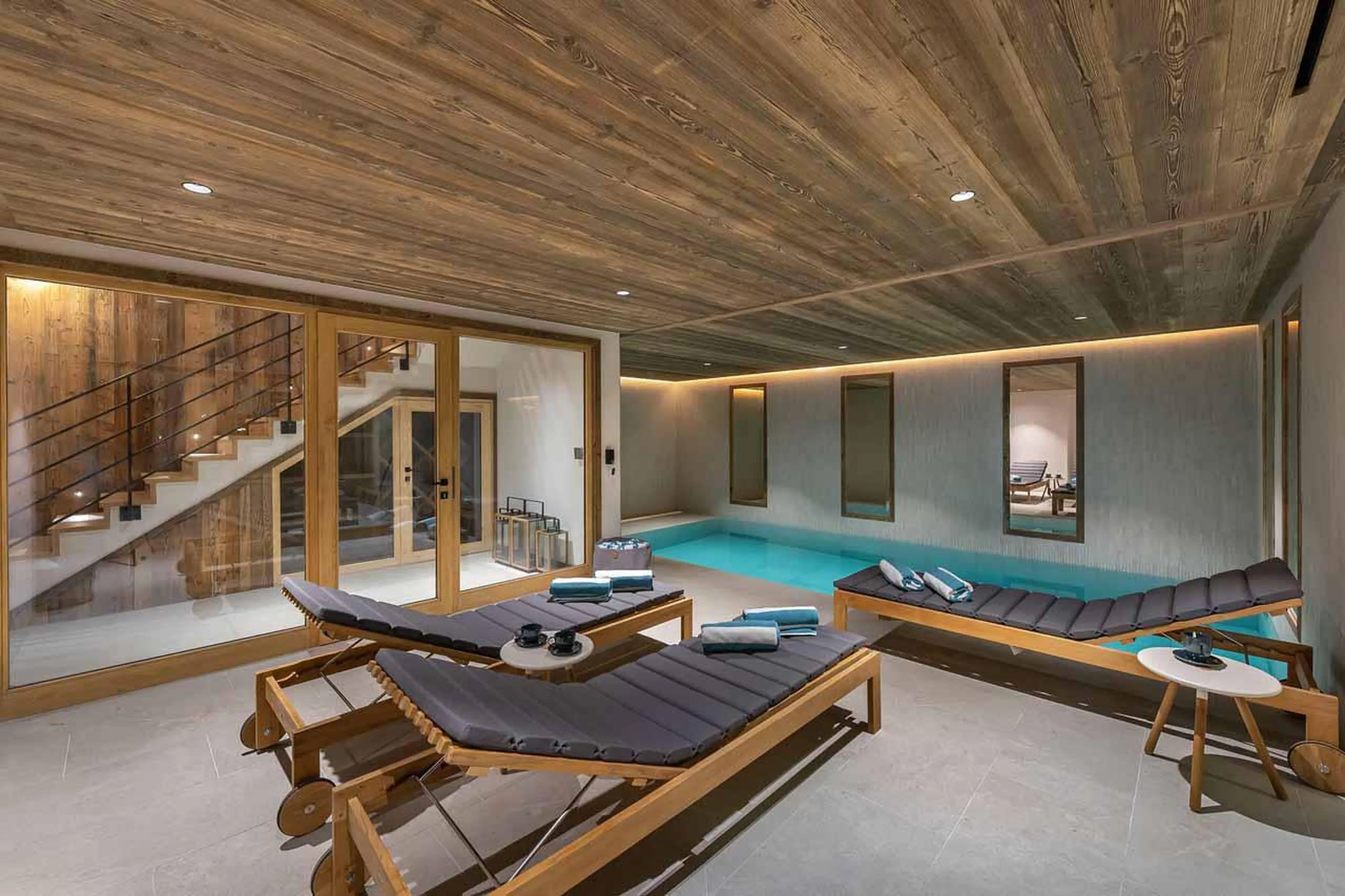 Indoor pool & loungers at Chalet Imladris in St Martin de Belleville