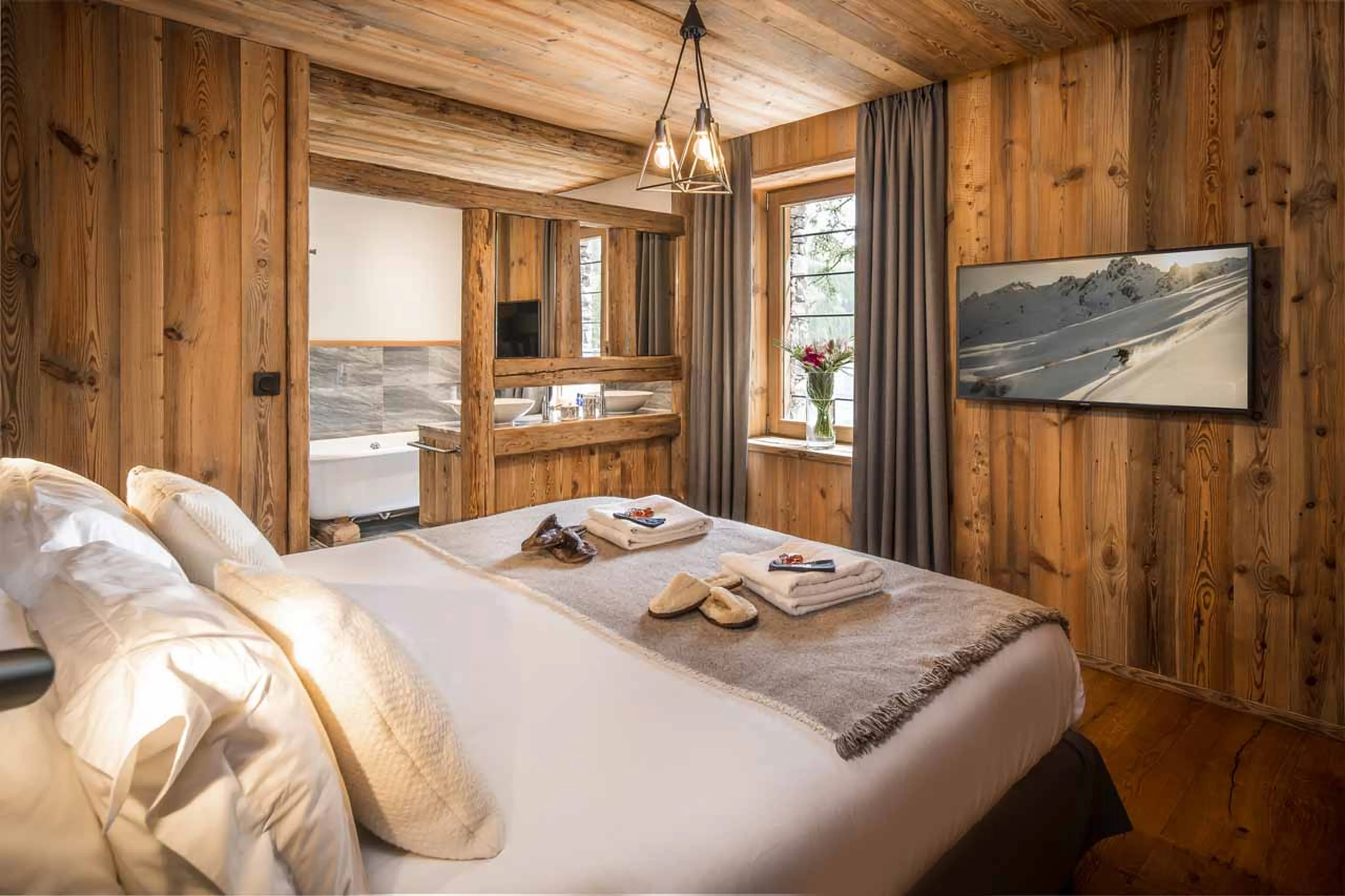 TV in master bedroom at Chalet Inoko in Val d'Isere