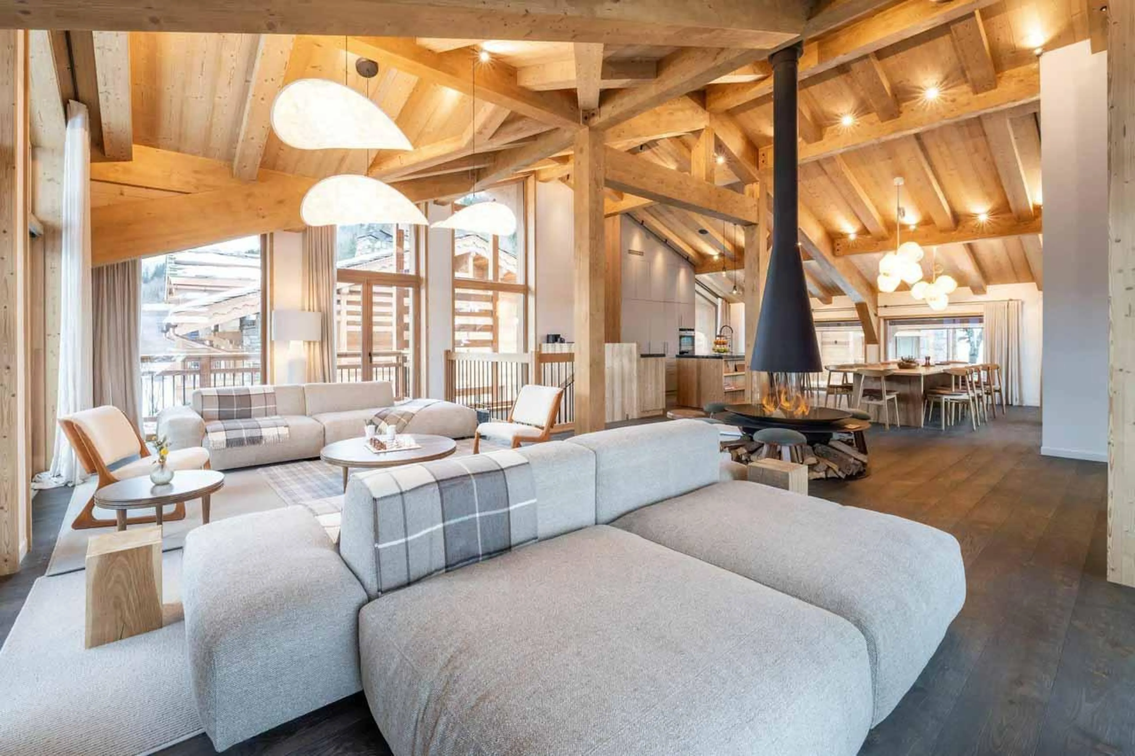 Light grey sofas and central fireplace in Chalet Irbis, Courchevel Le Praz
