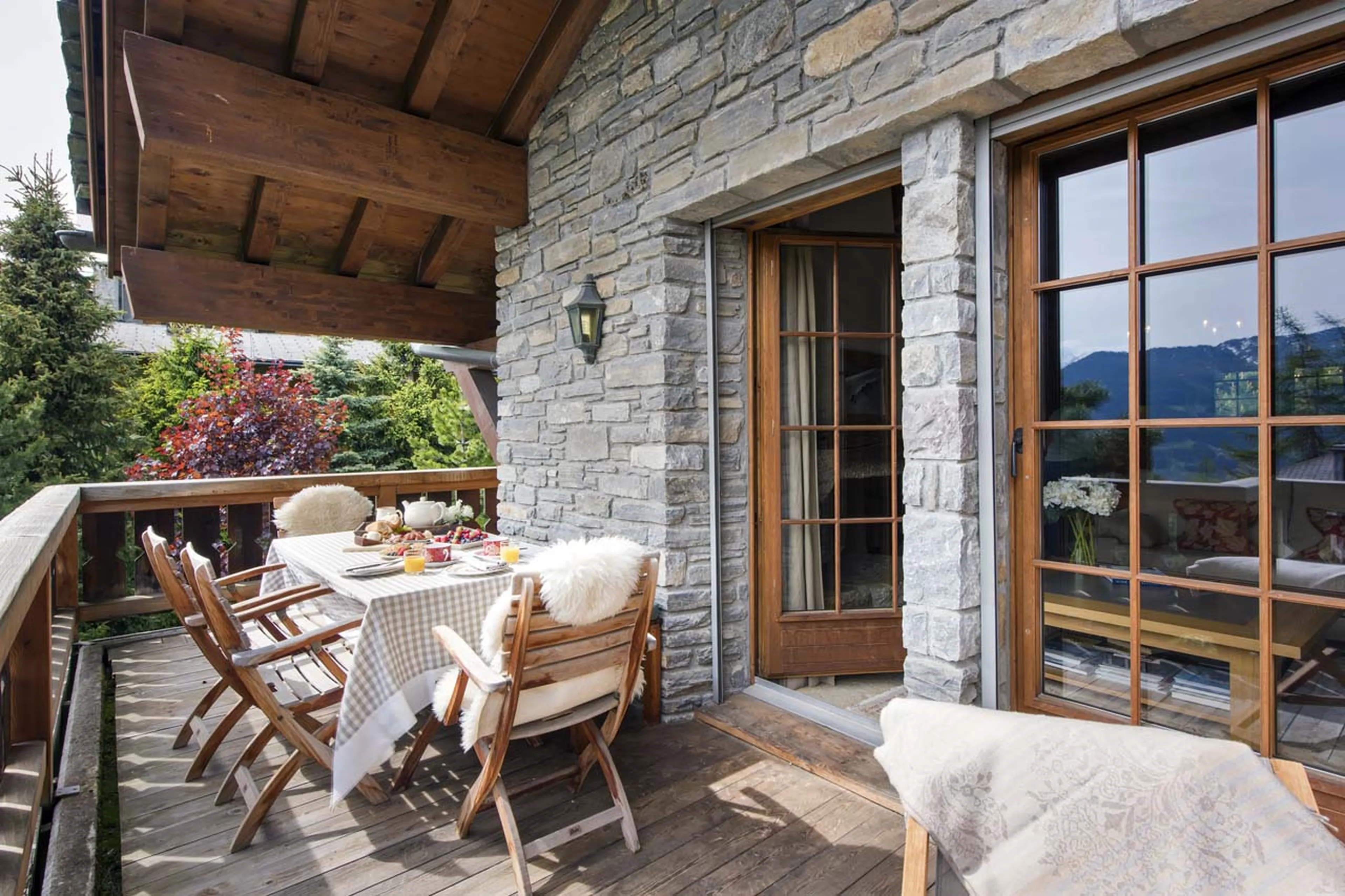 Terrace access from living room at Chalet Ivouette in Verbier