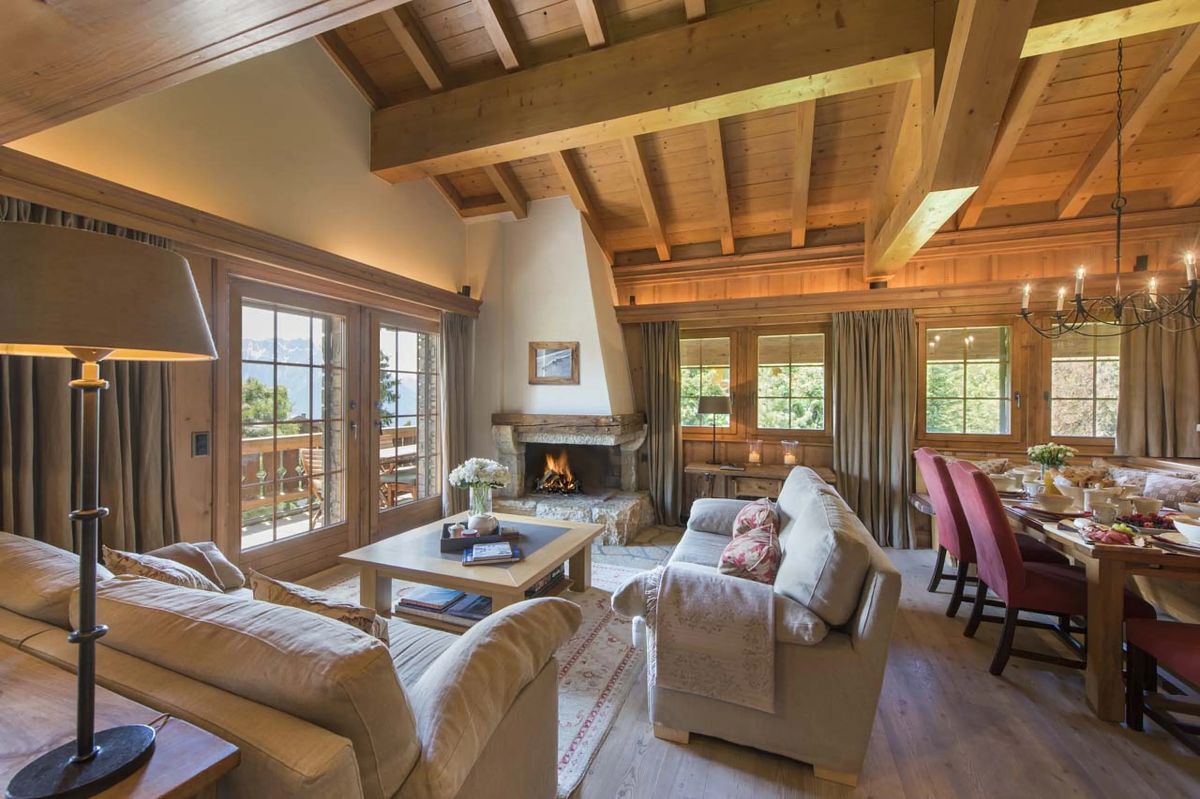 French windows leading to terrace from living room at Chalet Ivouette in Verbier
