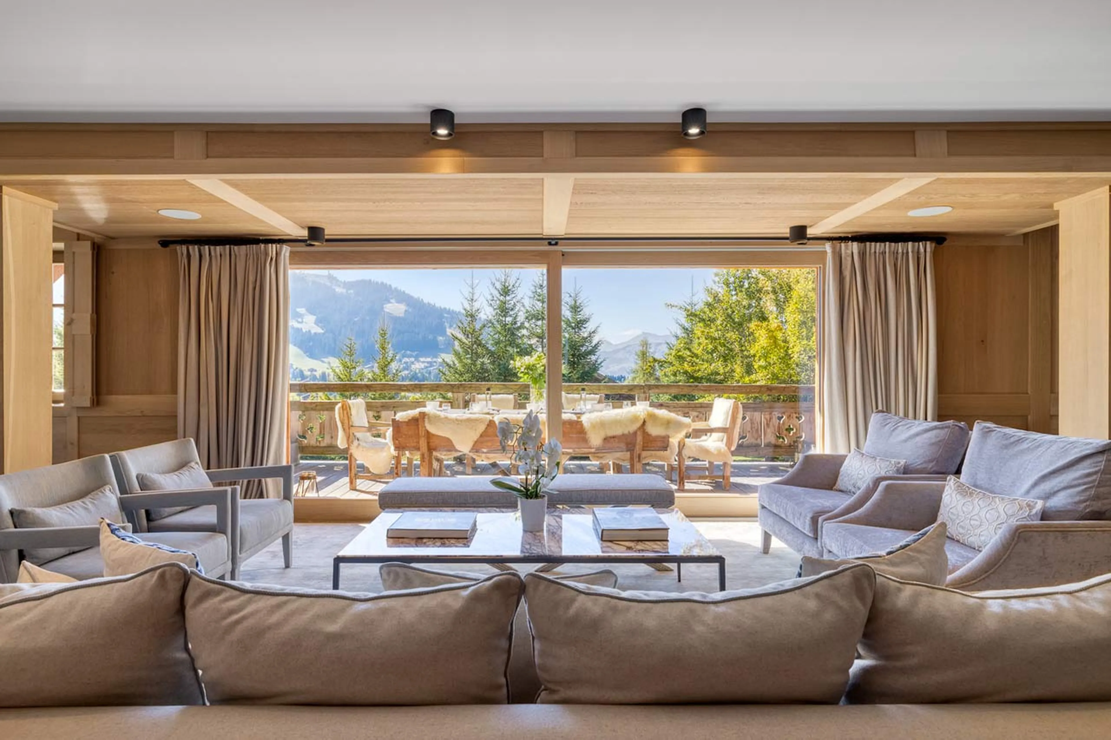 Living area and terrace in summer in Chalet Izoard in Megeve