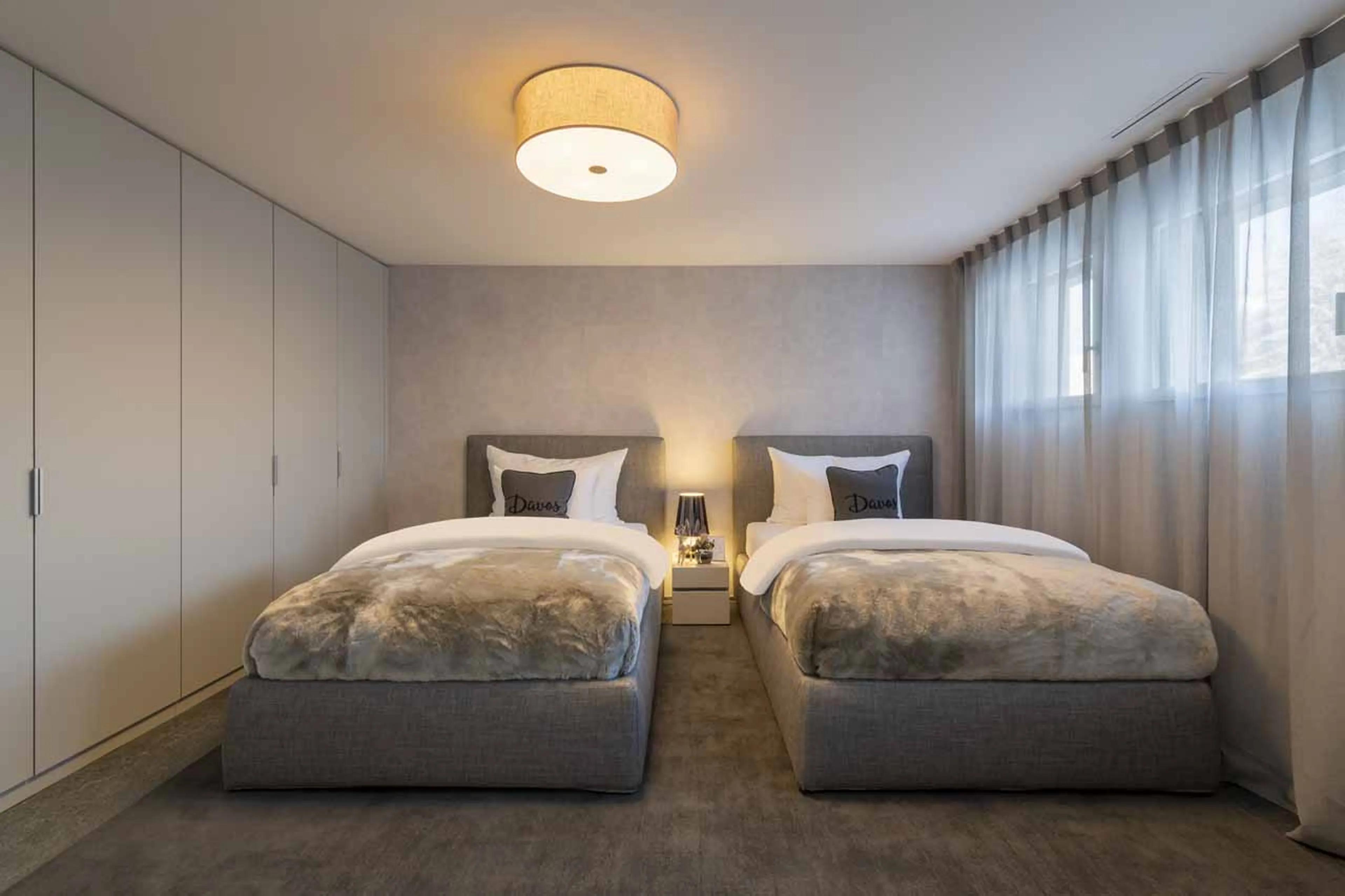 Twin beds at Chalet Jakobshorn in Davos
