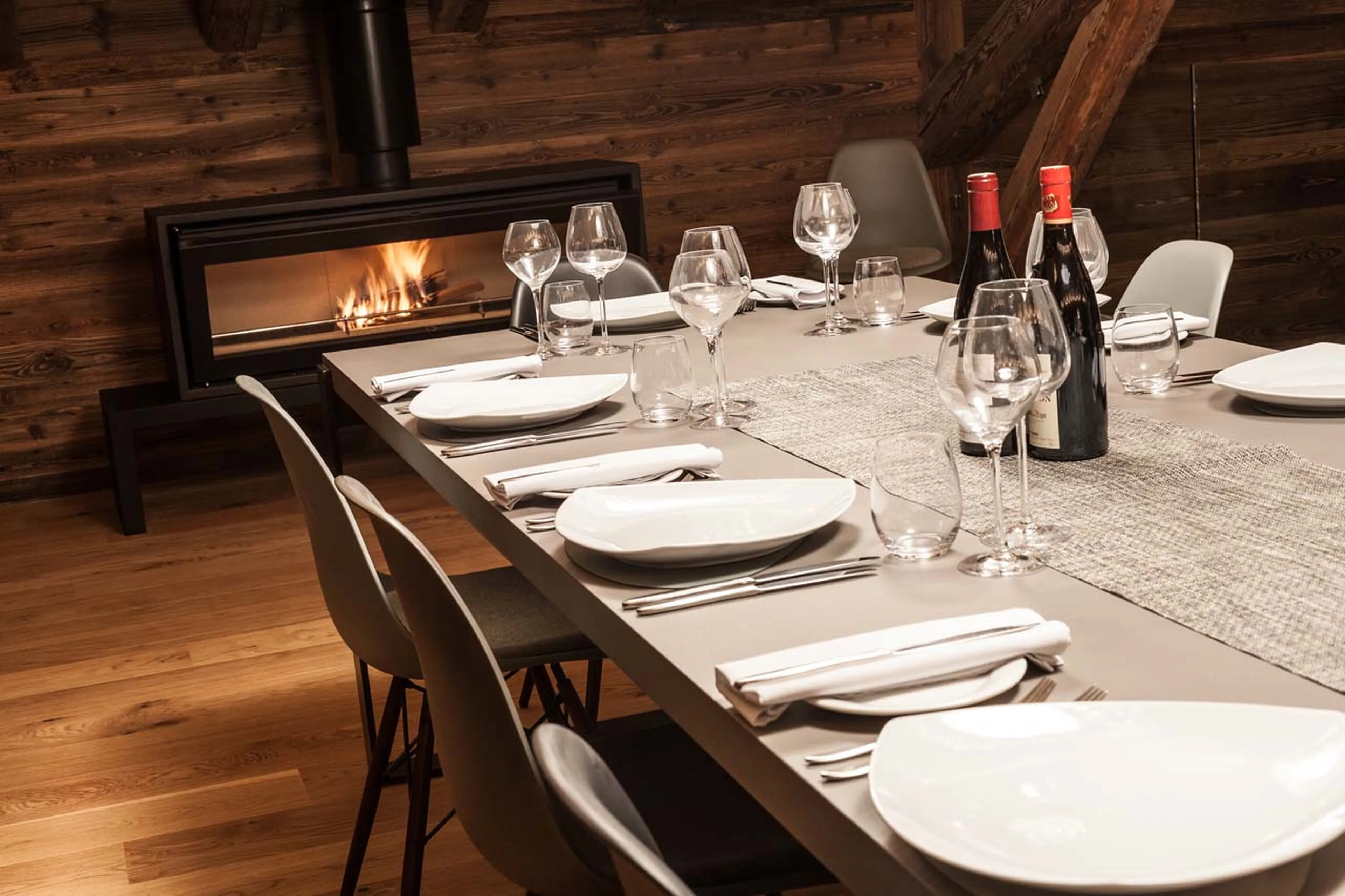 Wood-burner in dining room at Chalet Joux Plane in Morzine