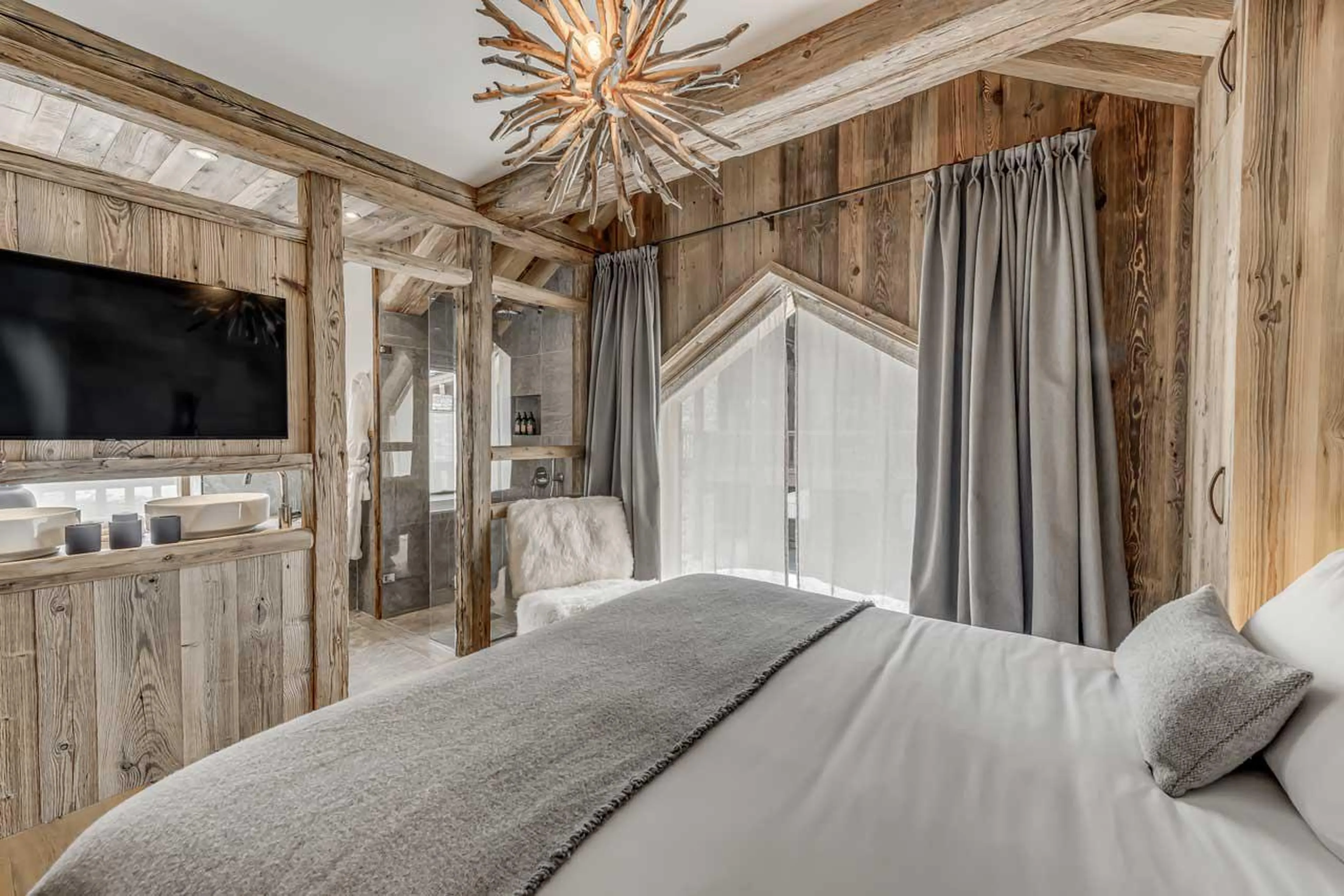 Bedroom four TV Bedroom three at Chalet Juno in Val d'Isere