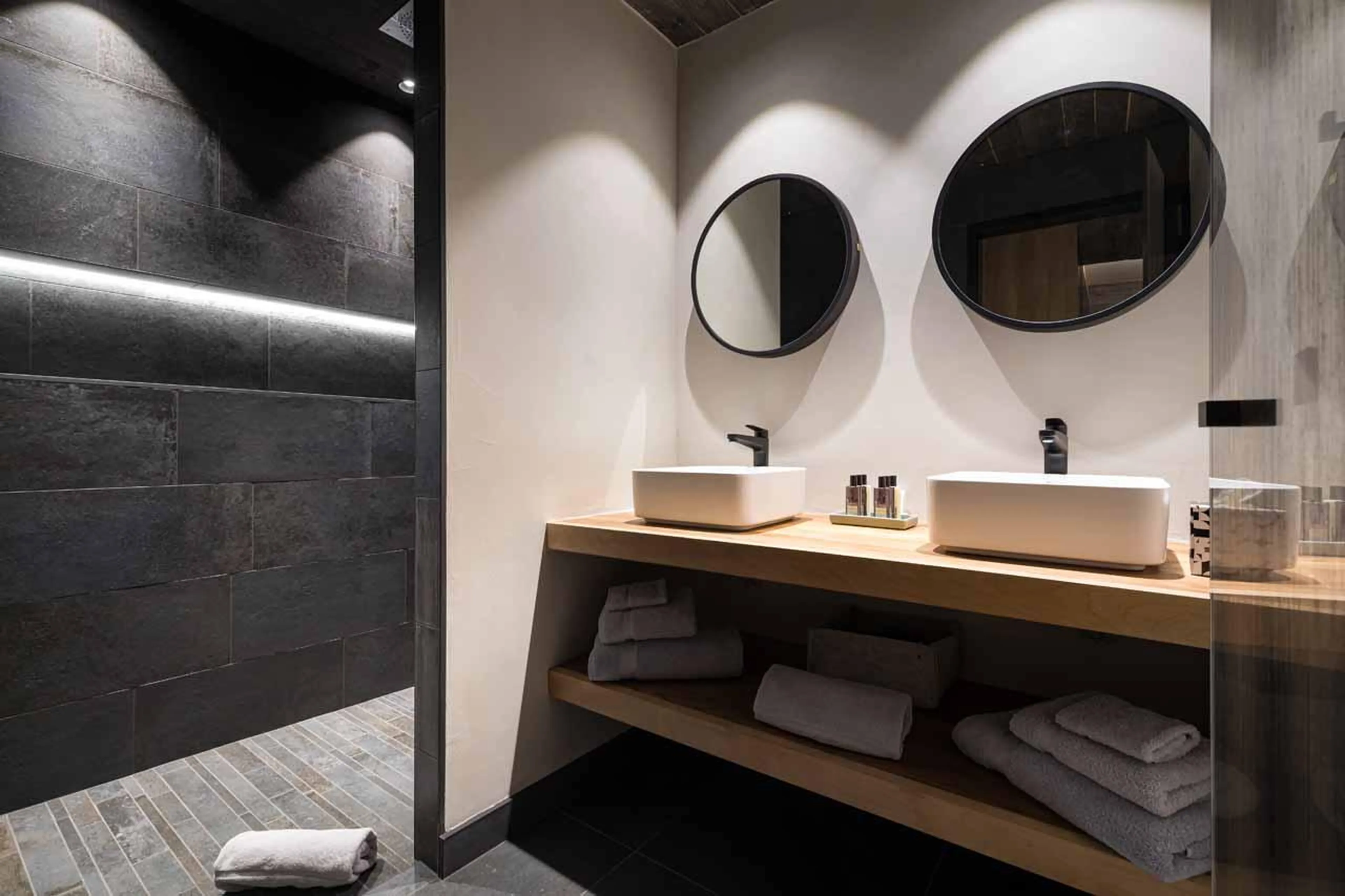 En-suite shower room with walk-in shower and double basin at Chalet Kandahar in Courchevel 1550