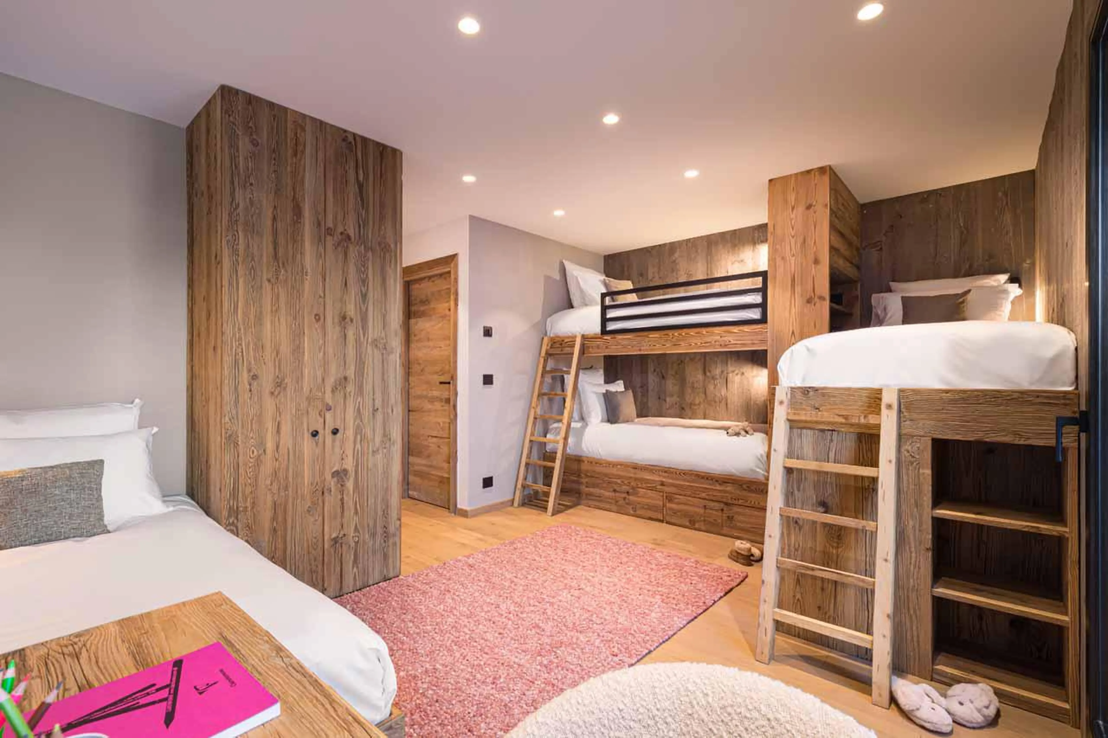 Bedroom with four single cabin-style beds at Chalet Kandahar in Courchevel 1550