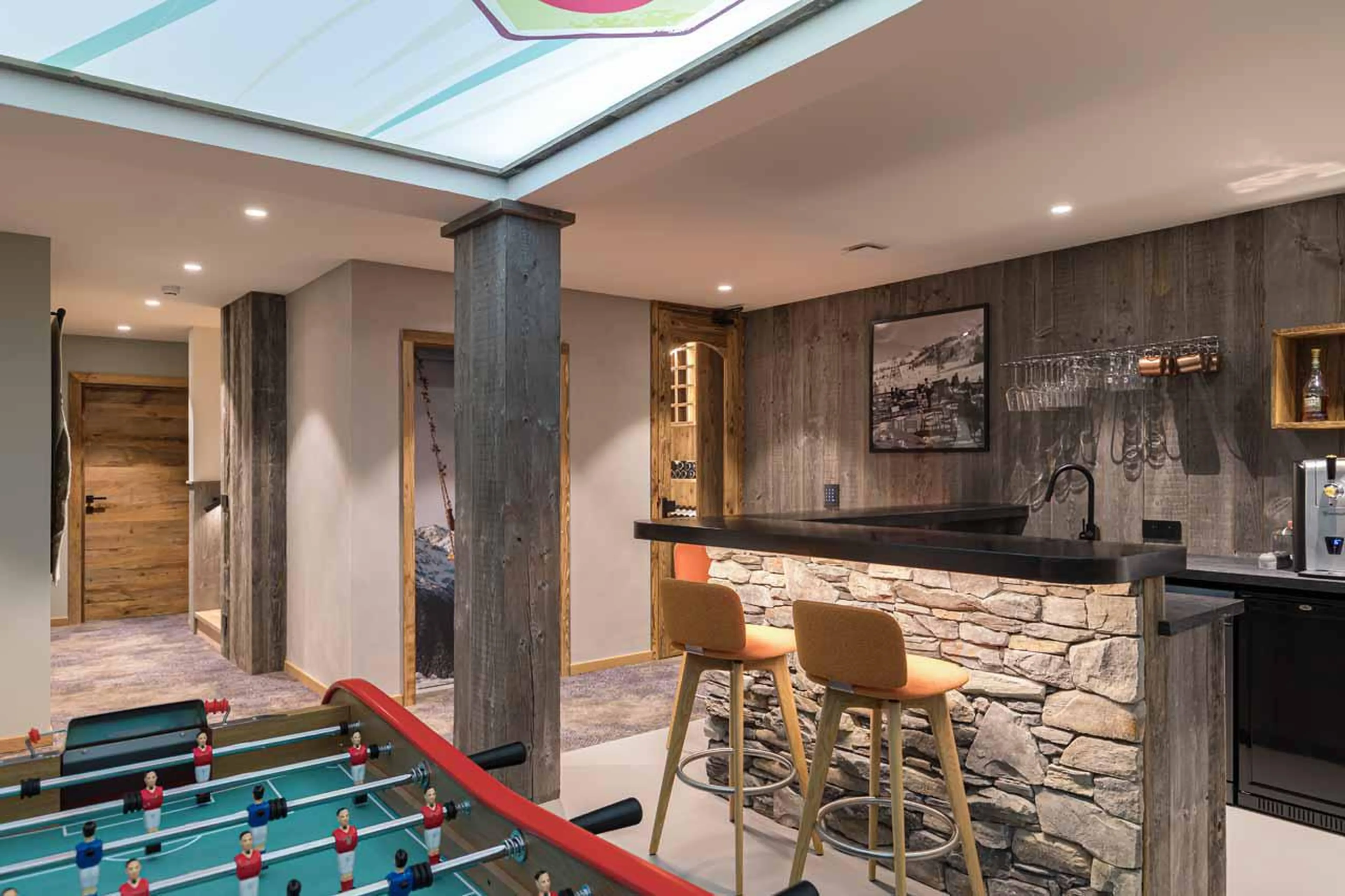 Bar and games room with table football & arcade games at Chalet Kandahar in Courchevel 1550