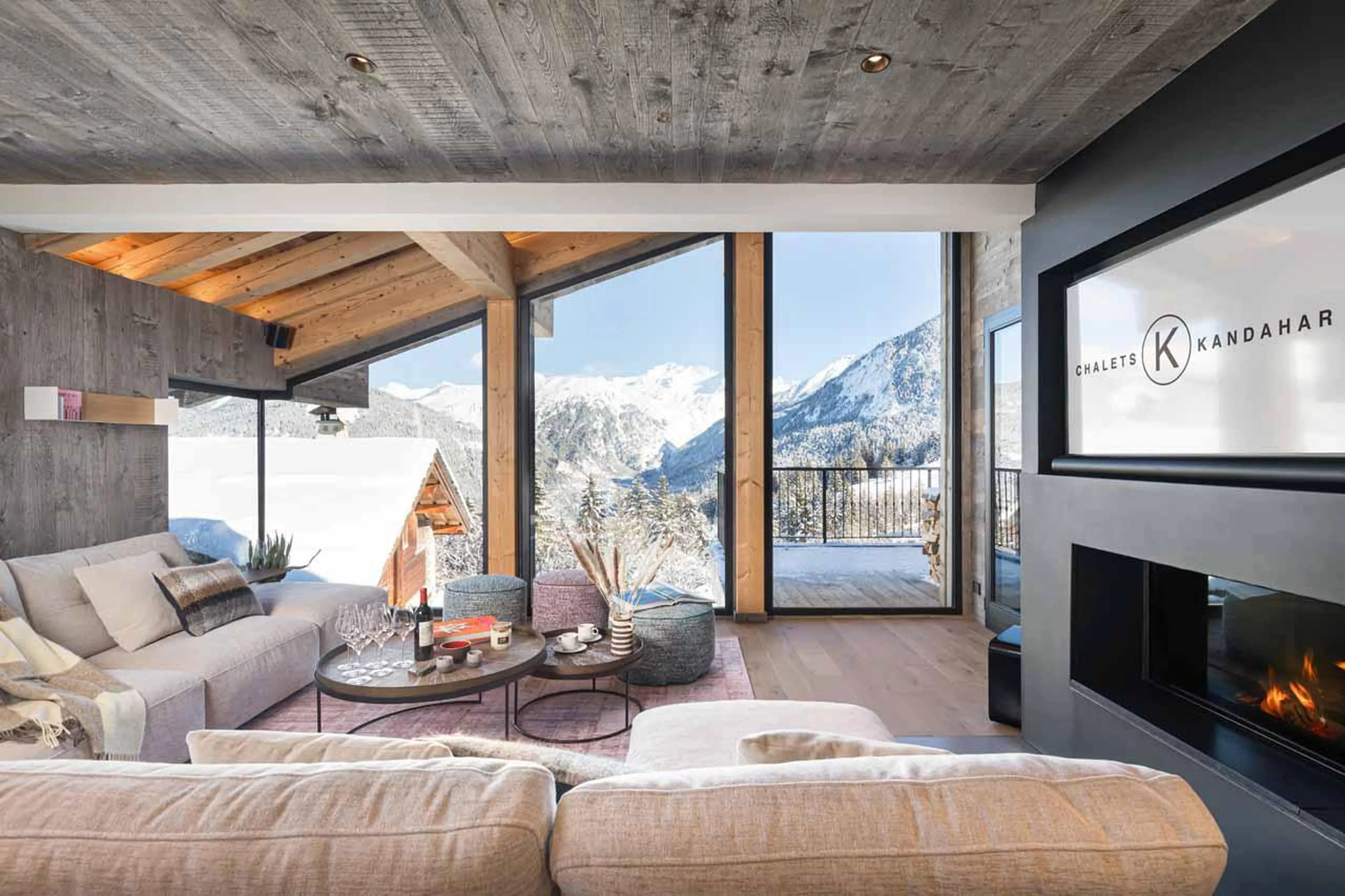 Sofa area overlooking spectacular mountain views at Chalet Kandahar in Courchevel 1550