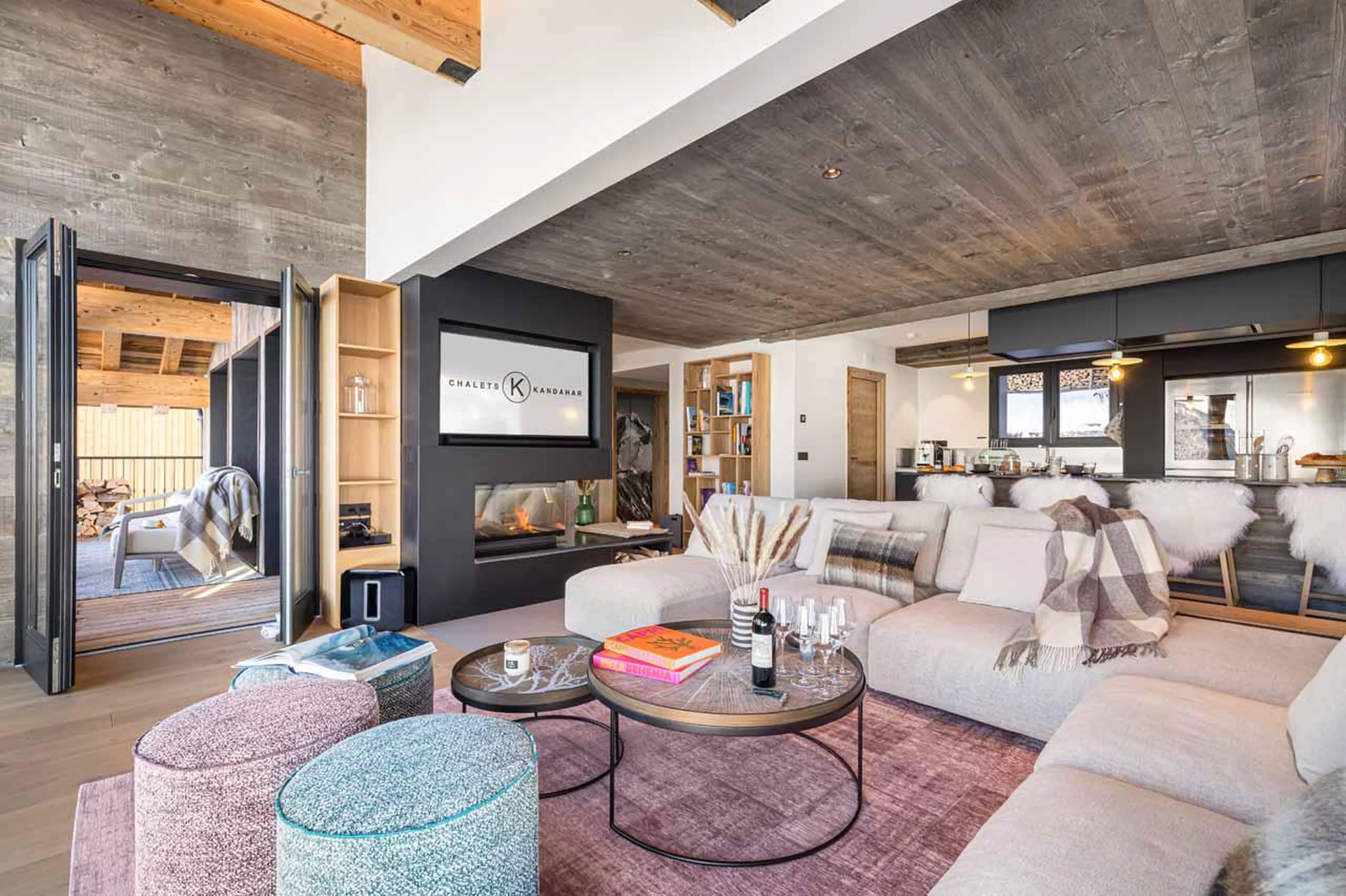 Living area leading to beautiful balcony area at Chalet Kandahar in Courchevel 1550