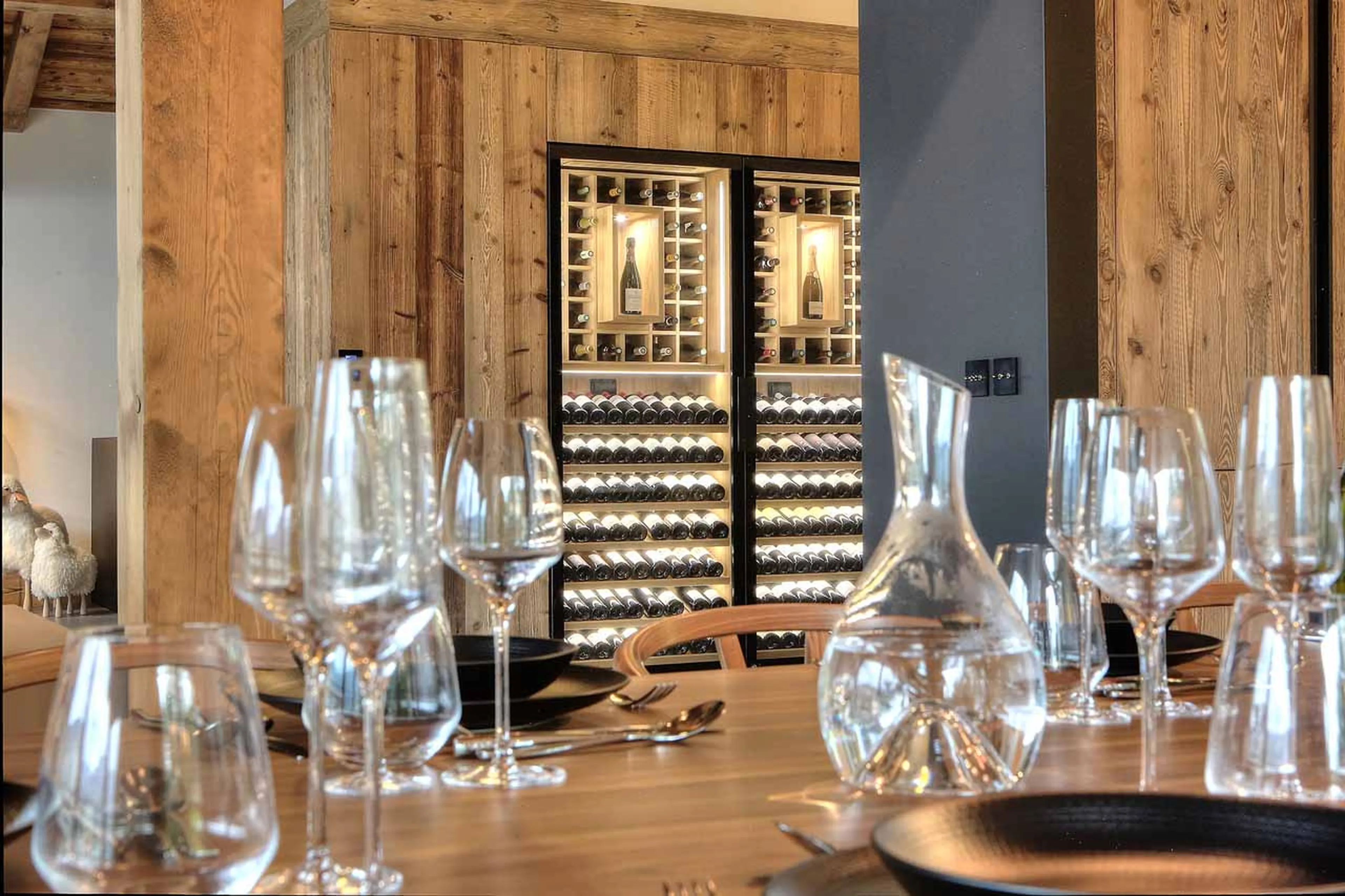 Dining table and wine store at Chalet Kantaa in Megeve