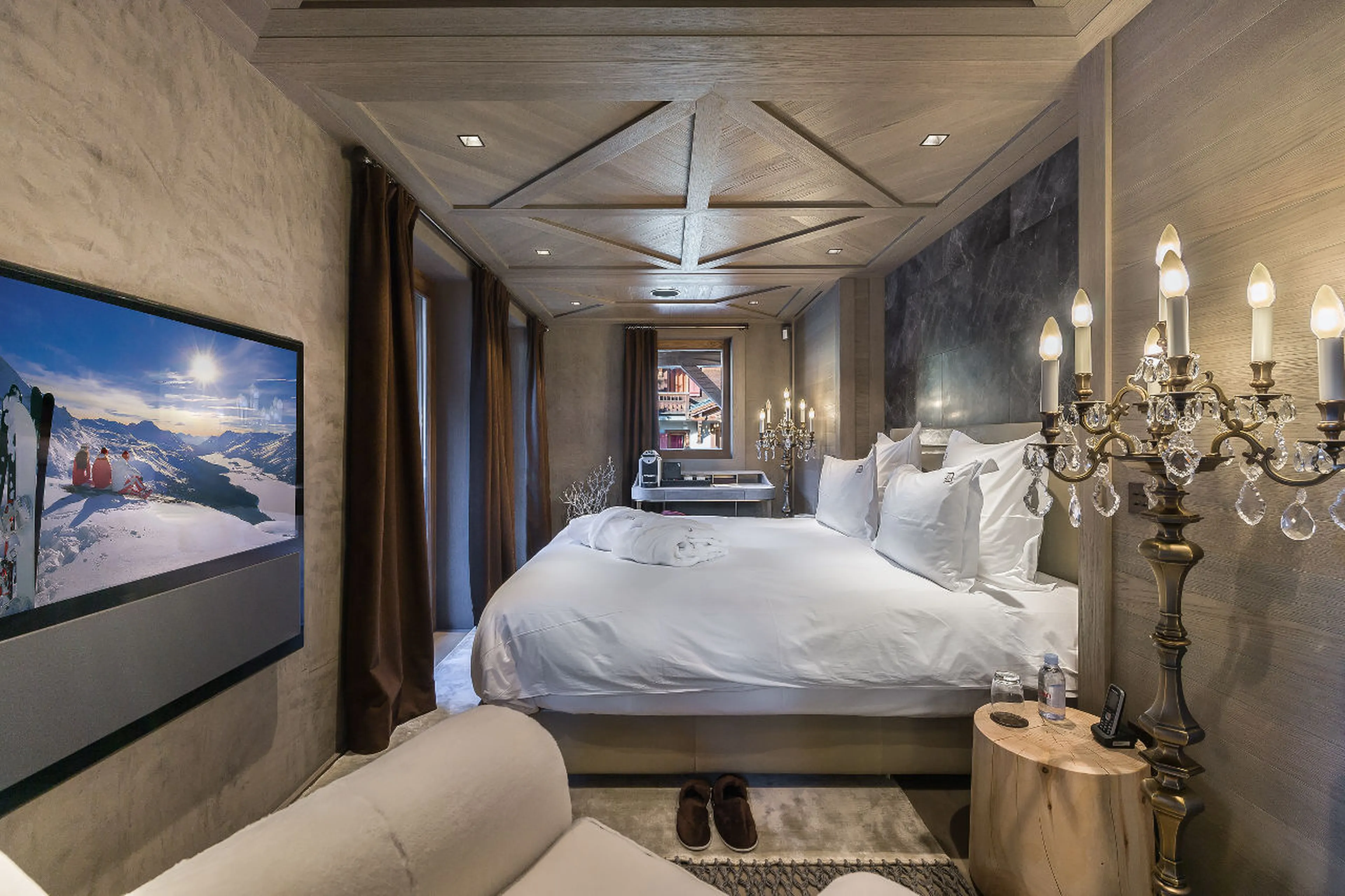 Double bedroom with wide screen TV in La Datcha in Courchevel 1850