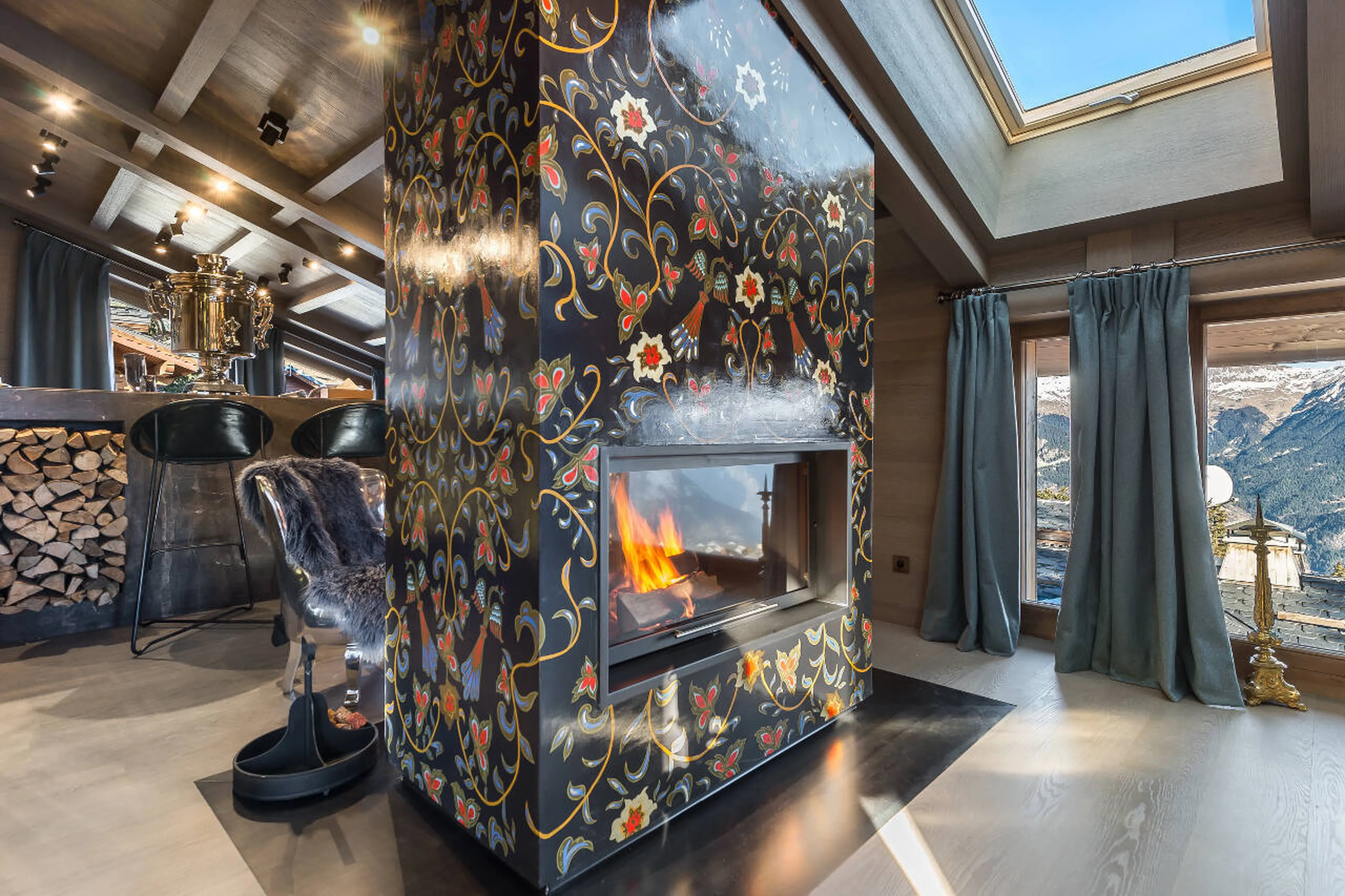 Fireplace chimney with ethnic Russian patterns in La Datcha in Courchevel 1850