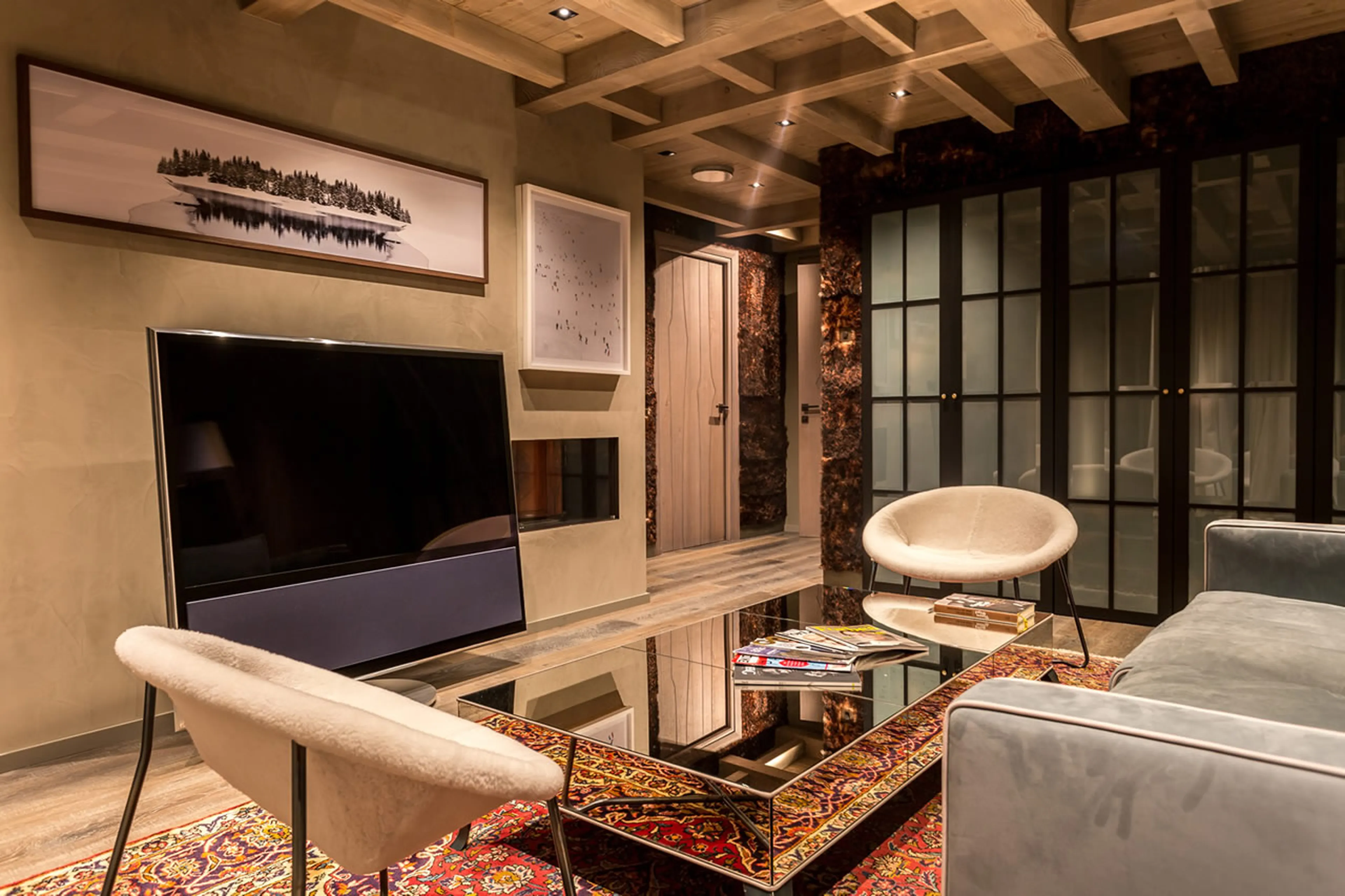 Suite 1, master lounge with fireplace on third floor of Chalet La Datcha in Val Thorens