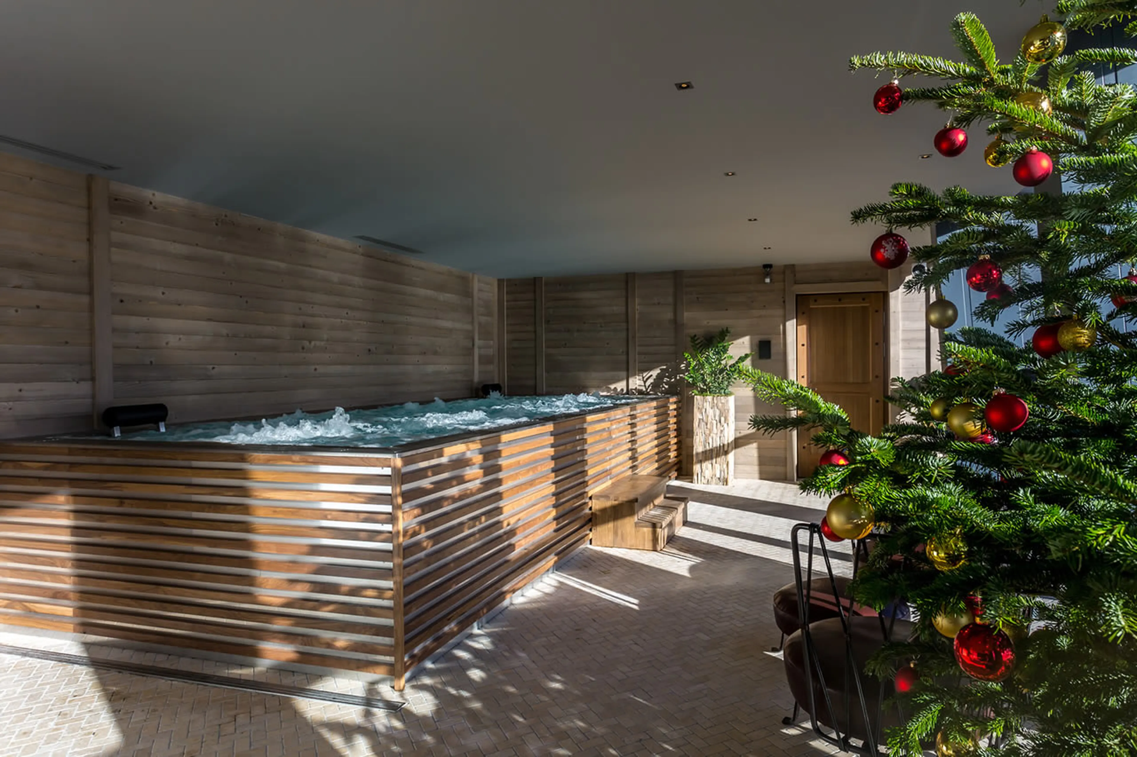 Large indoor Jacuzzi with a view in Chalet La Datcha in Val Thorens
