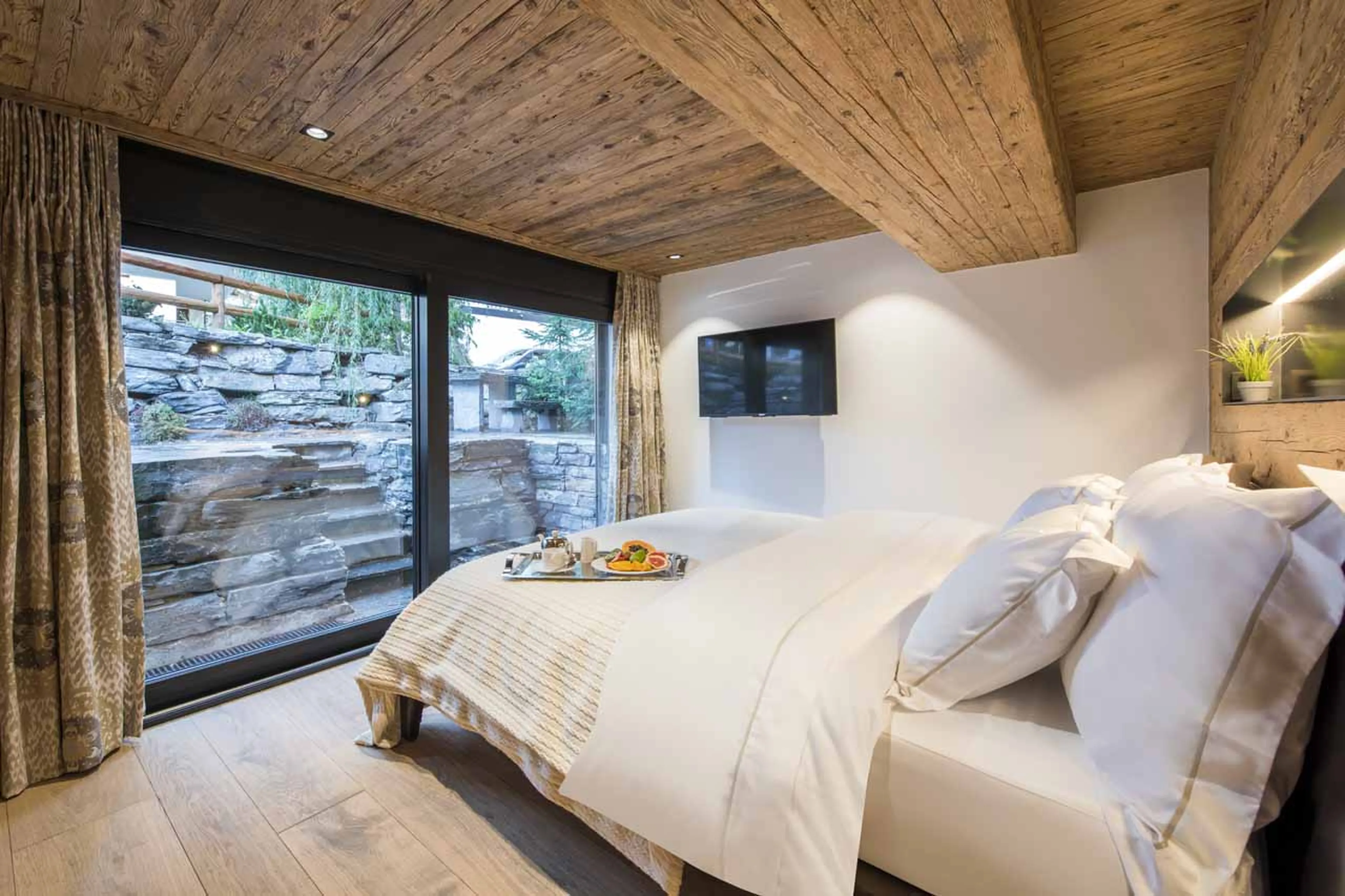 Bedroom one at Chalet La Datcha in Verbier