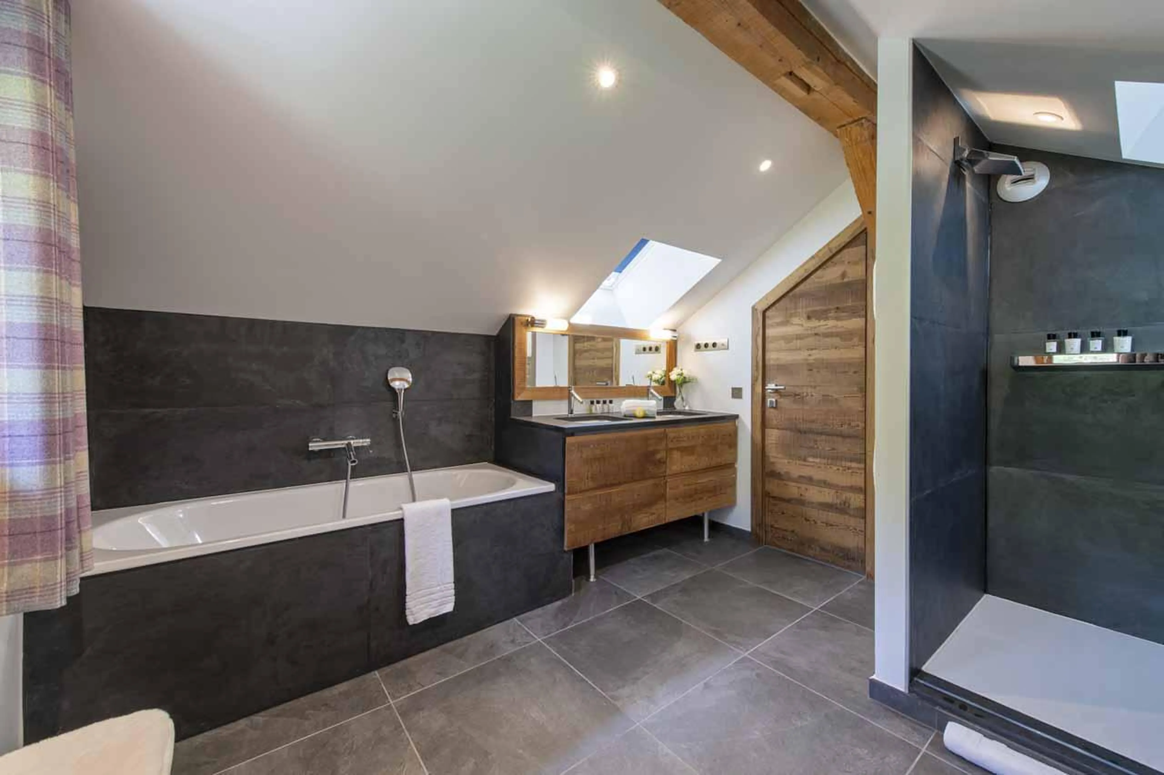 En-suite bathroom with separate shower and double basin in Chalet La Folie, Meribel