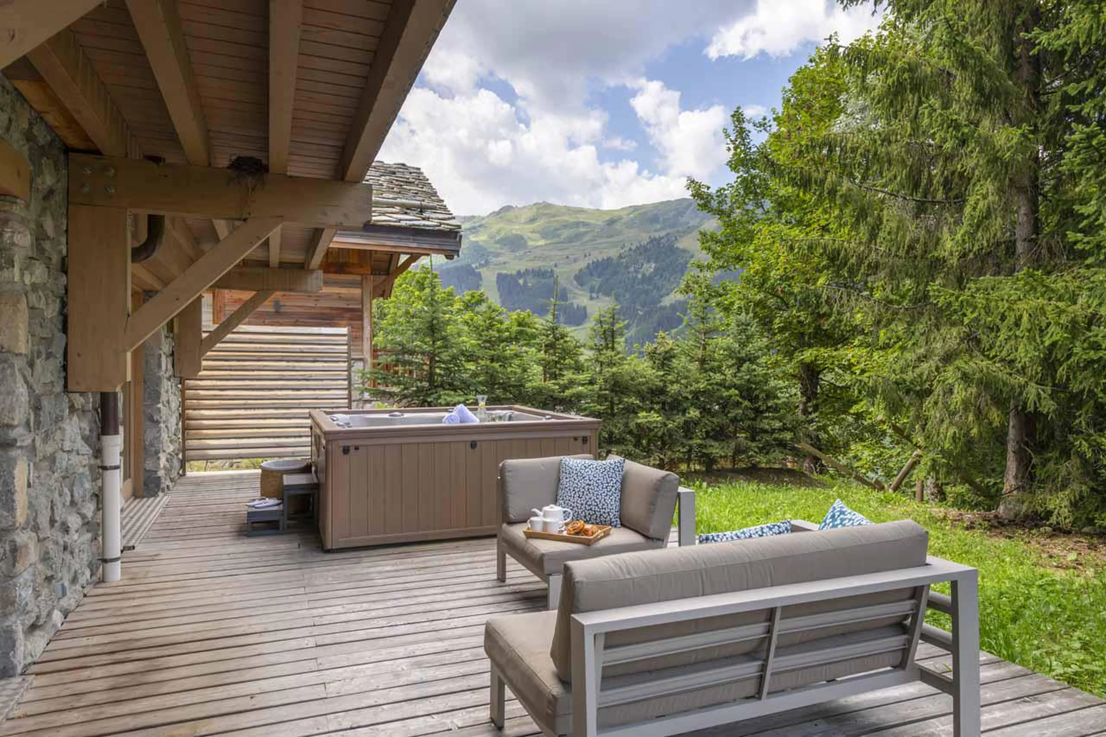 Outdoor hot tub and seating in Chalet La Folie, Meribel