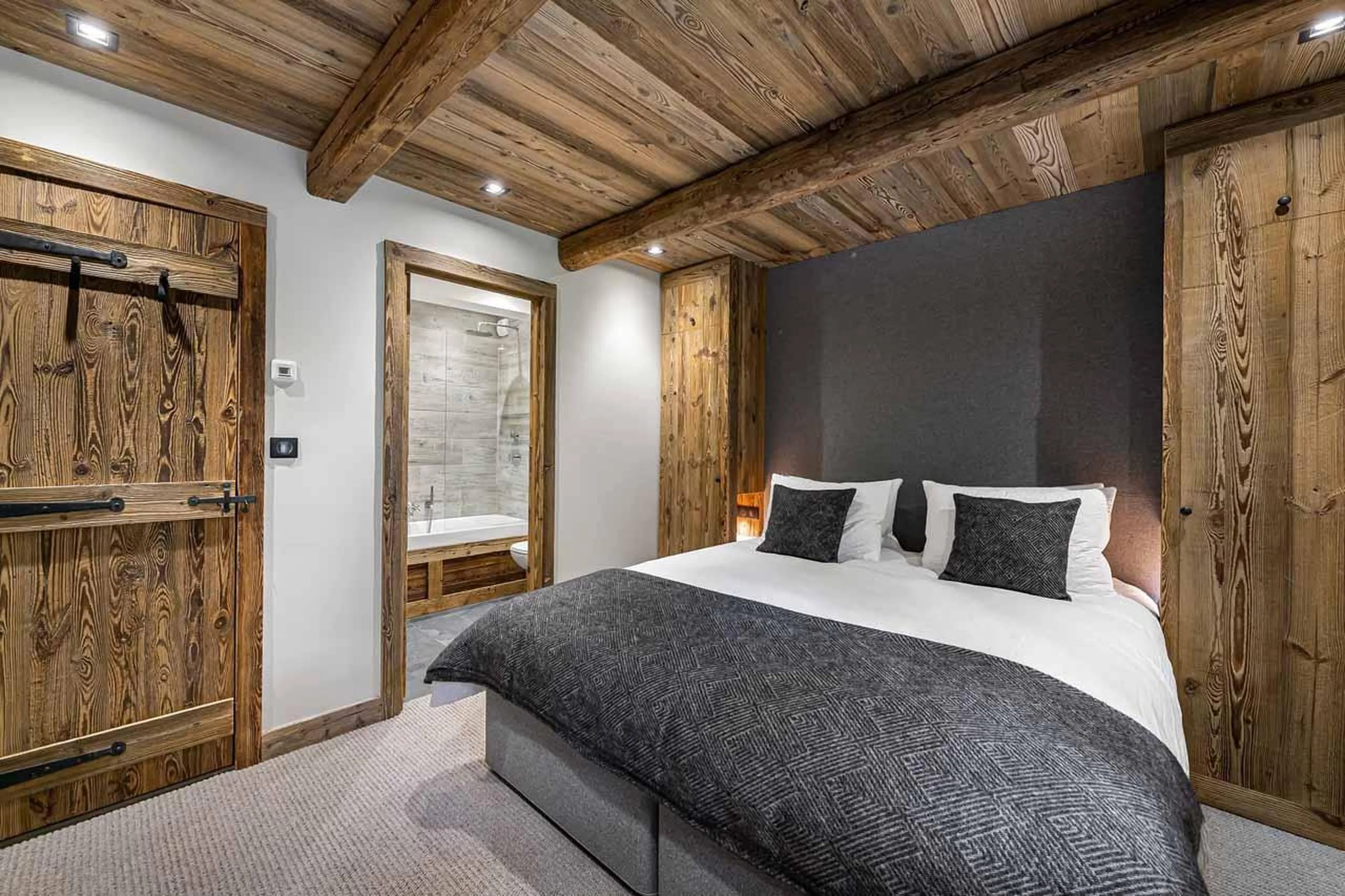 Bedroom two with bathroom at Chalet La Grange in St Martin de Belleville