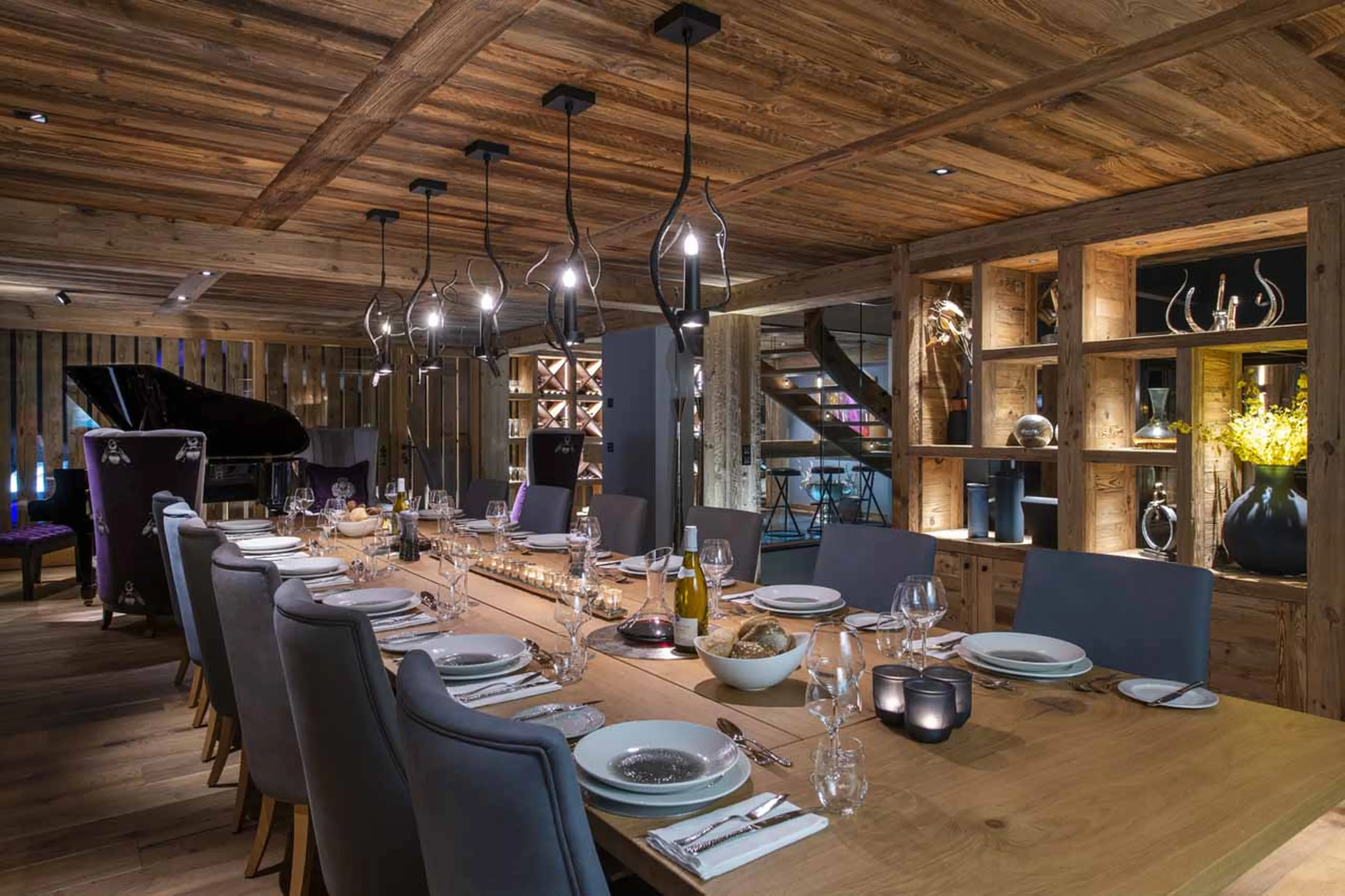 Dining area with baby grand piano at Chalet La Maison in Morzine