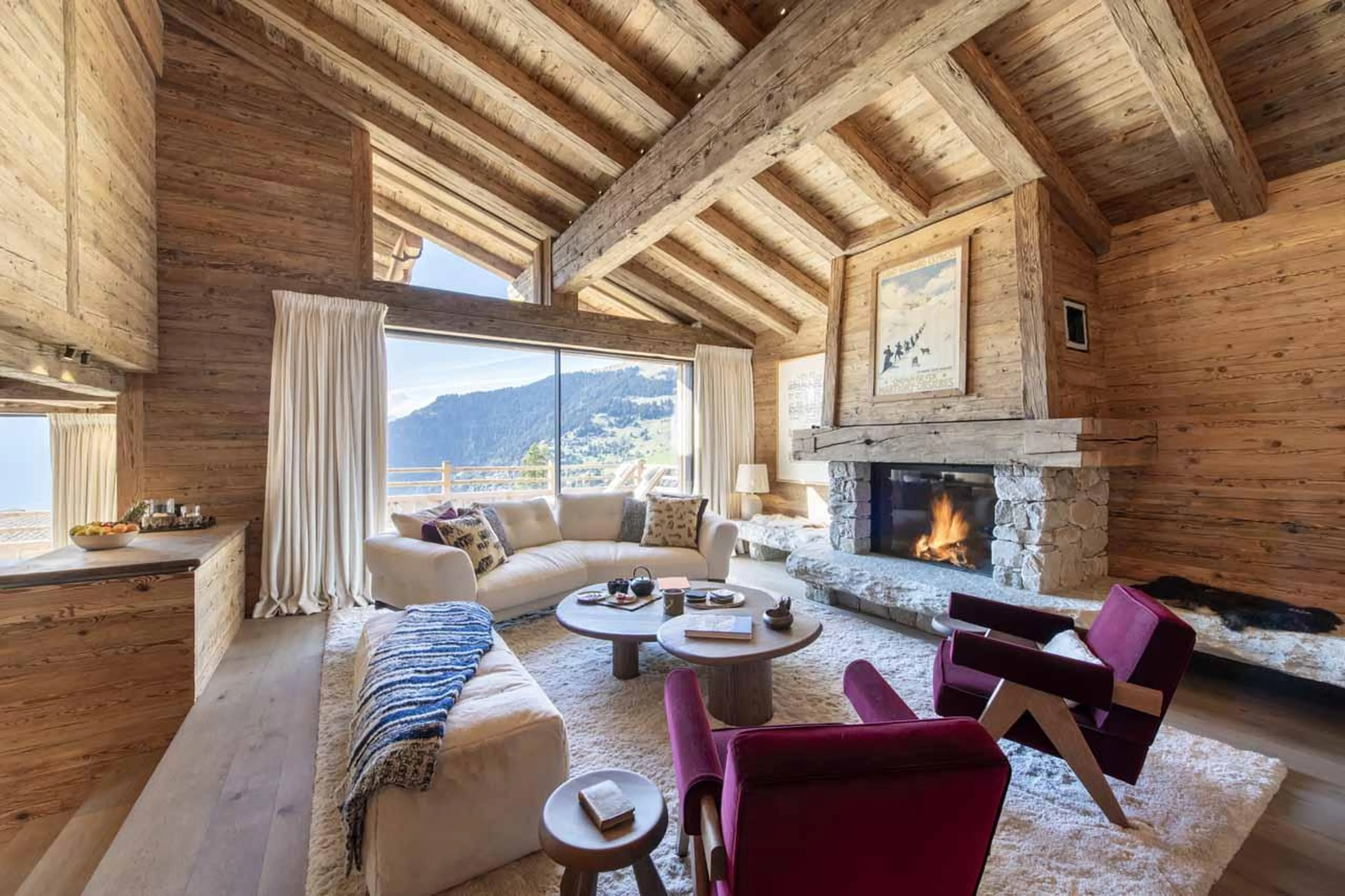 Living room with sofas and fireplace in Chalet La Rochette, Verbier