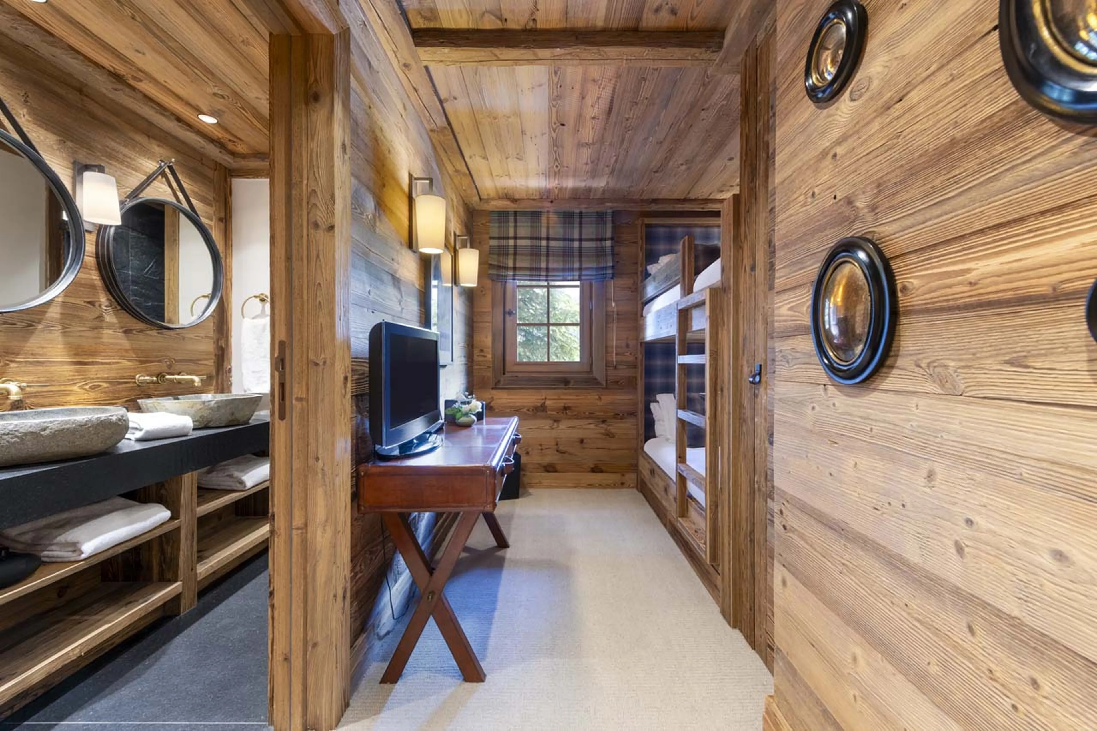 Bunk bedroom with en-suite shower room in Chalet La Taniere, Meribel
