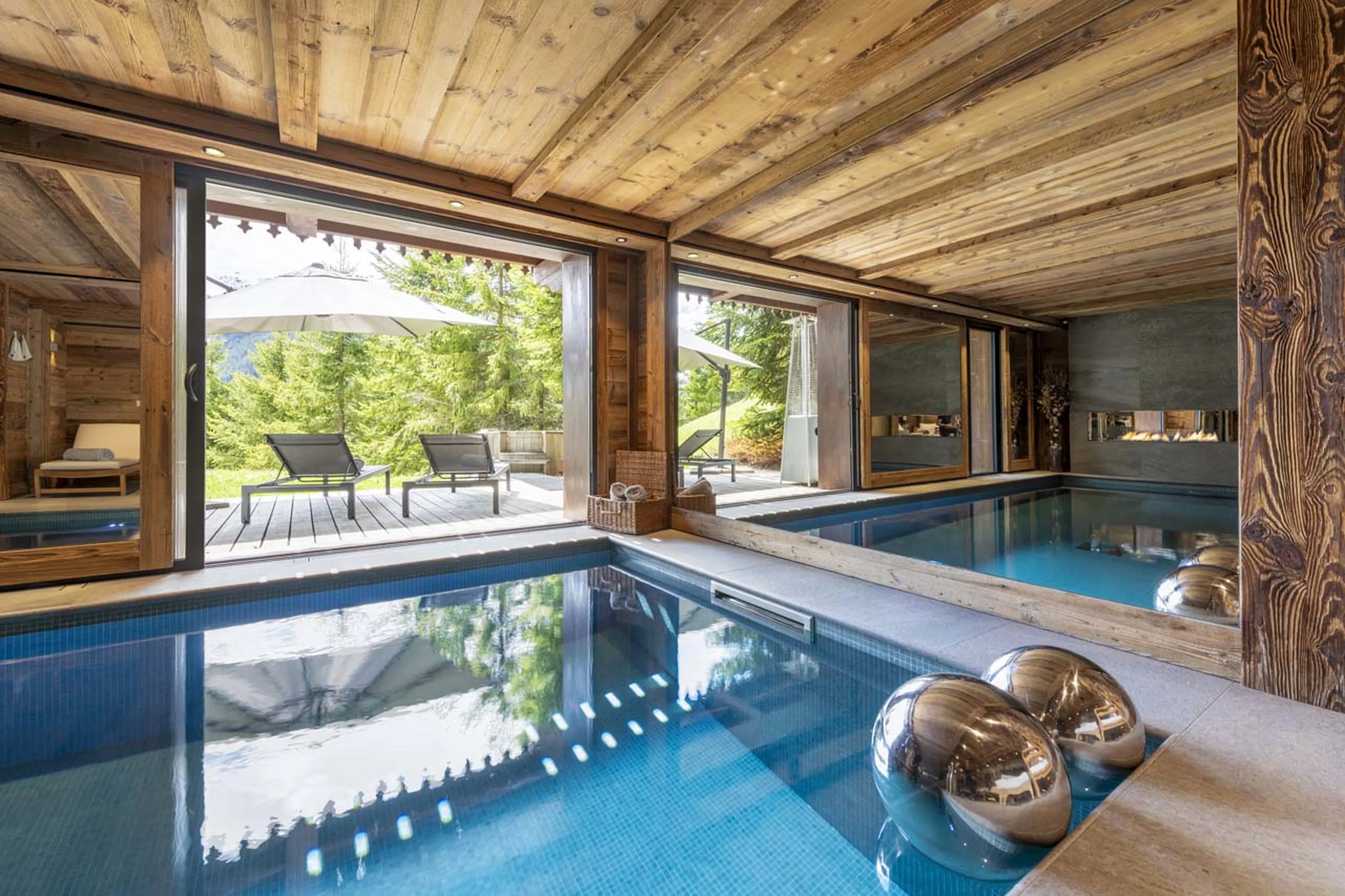 Terrace access from pool area at Chalet La Taniere in Meribel