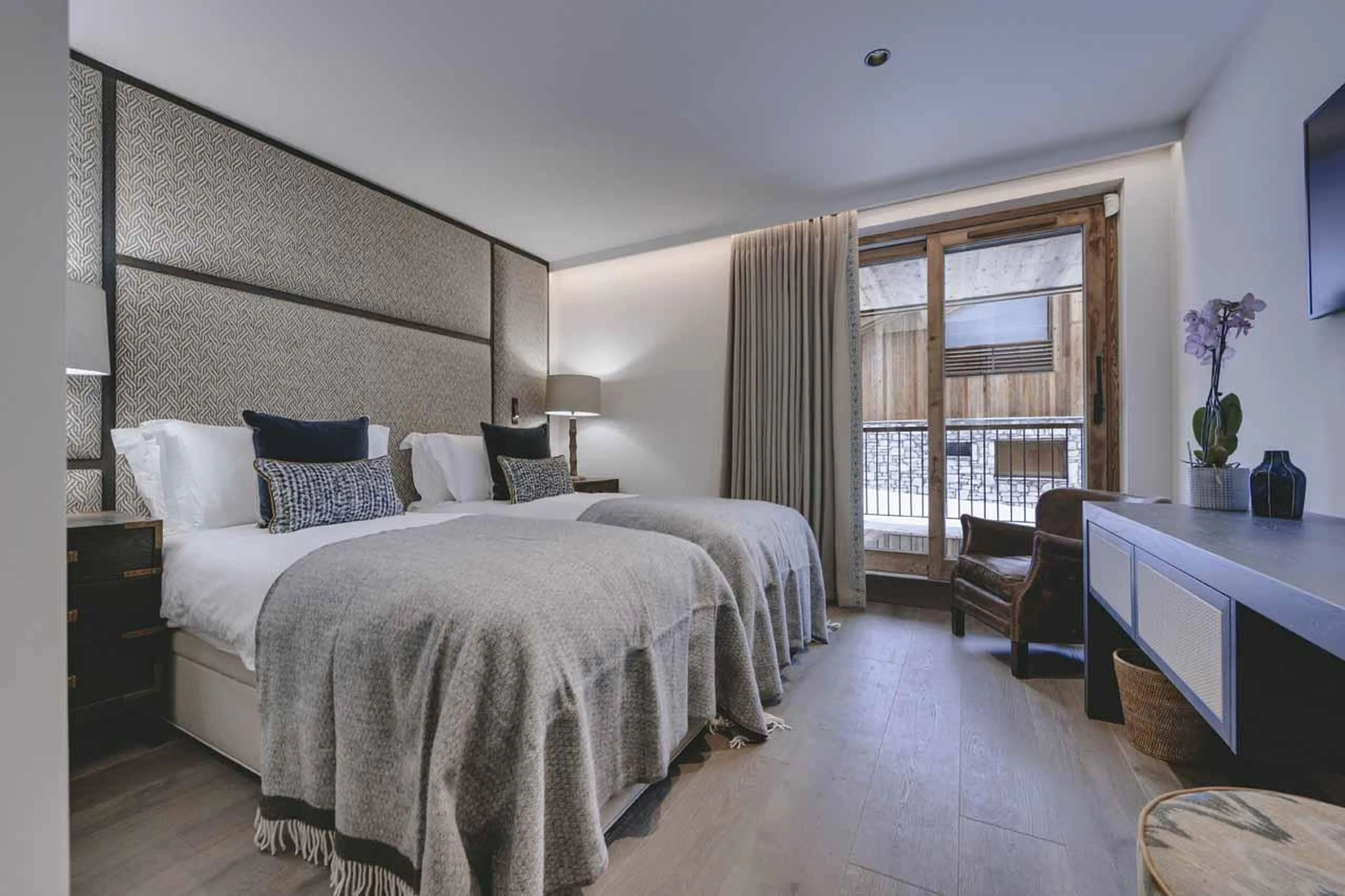 Twin bedroom with glass doors at Chalet La Tene, Val d'Isere