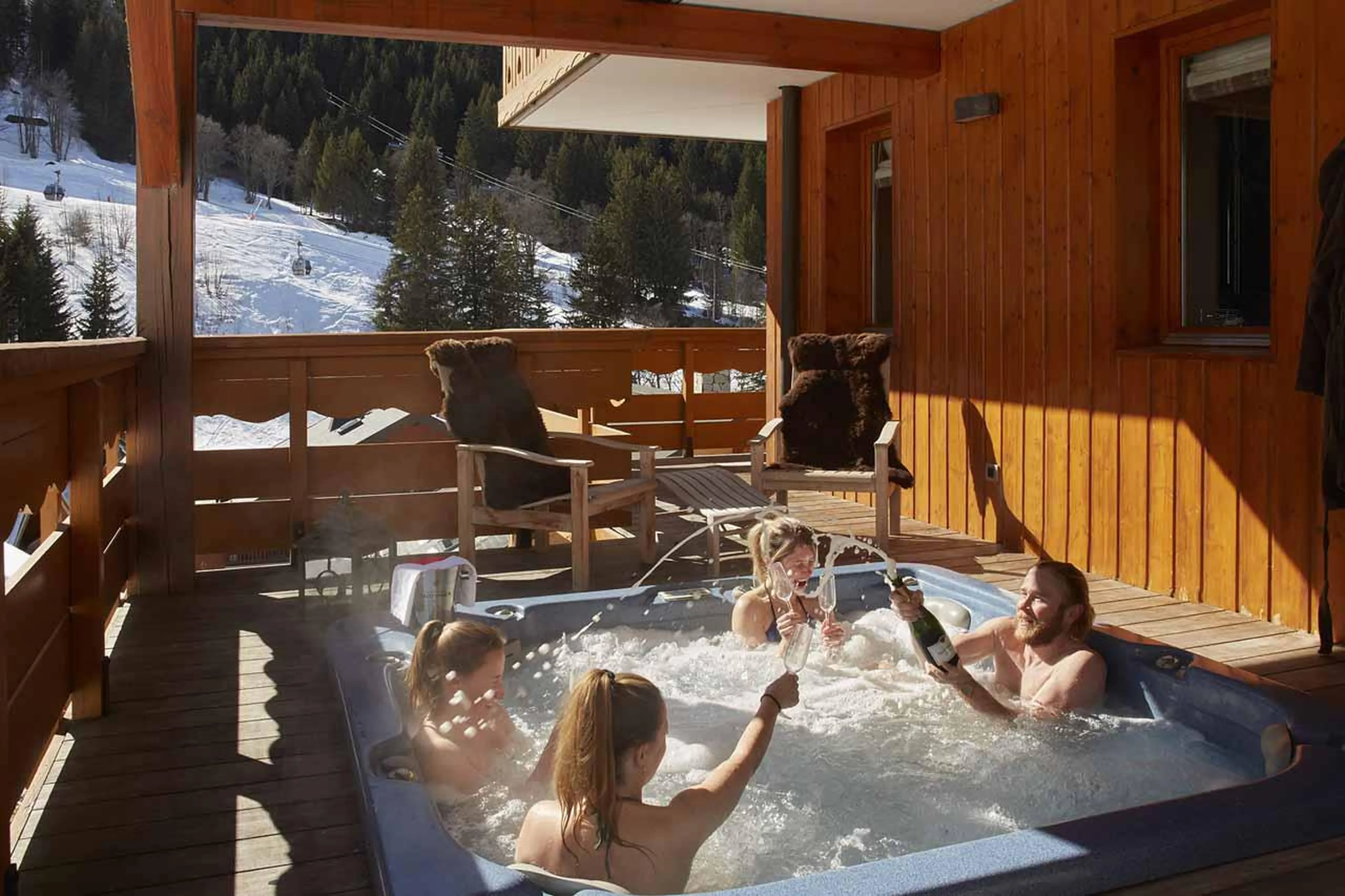 Outdoor hot tub on secluded private south-facing balcony at Chalet Lapin Blanc in Meribel