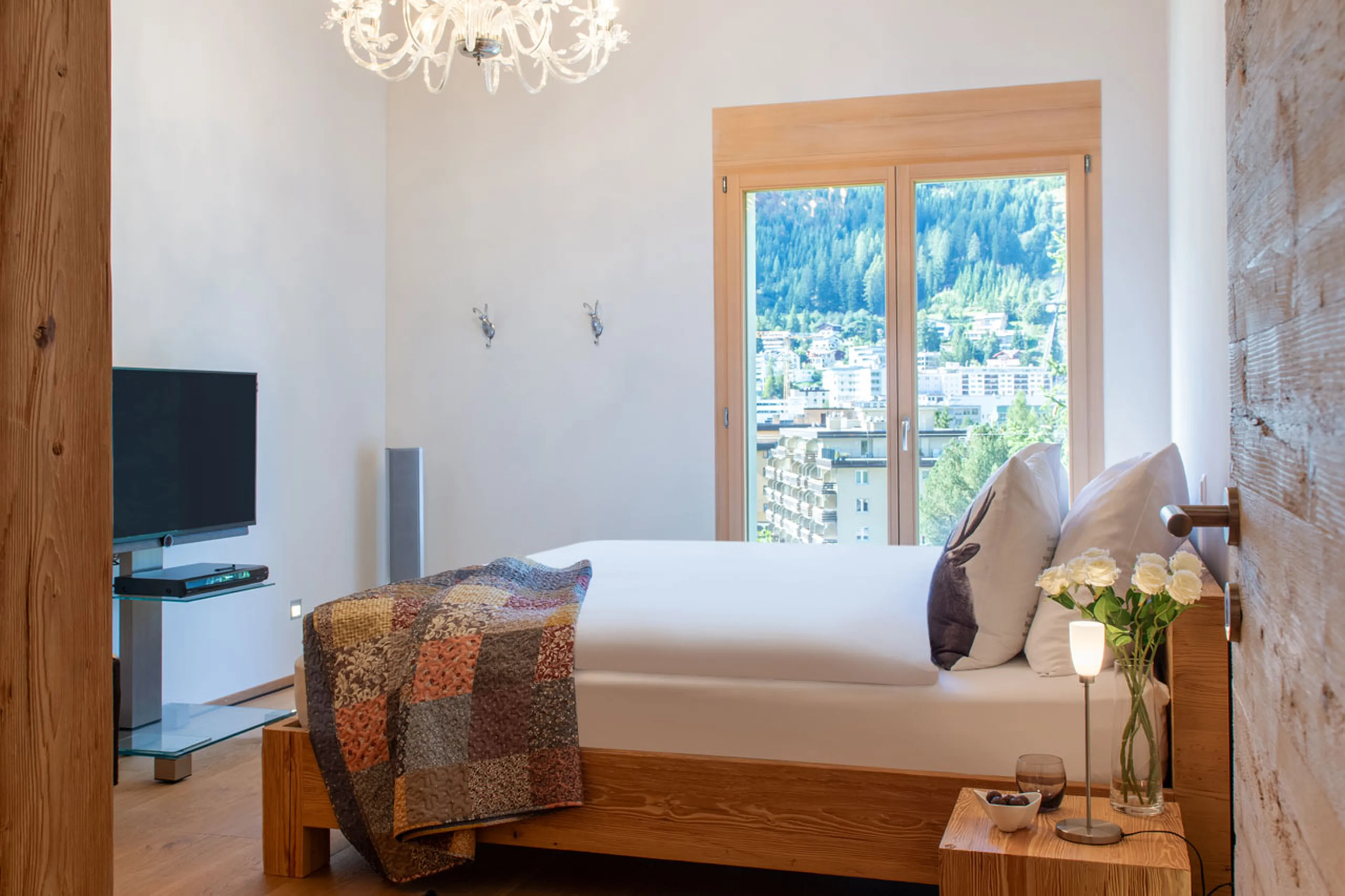 TV in bedroom three at Chalet Larch in Davos
