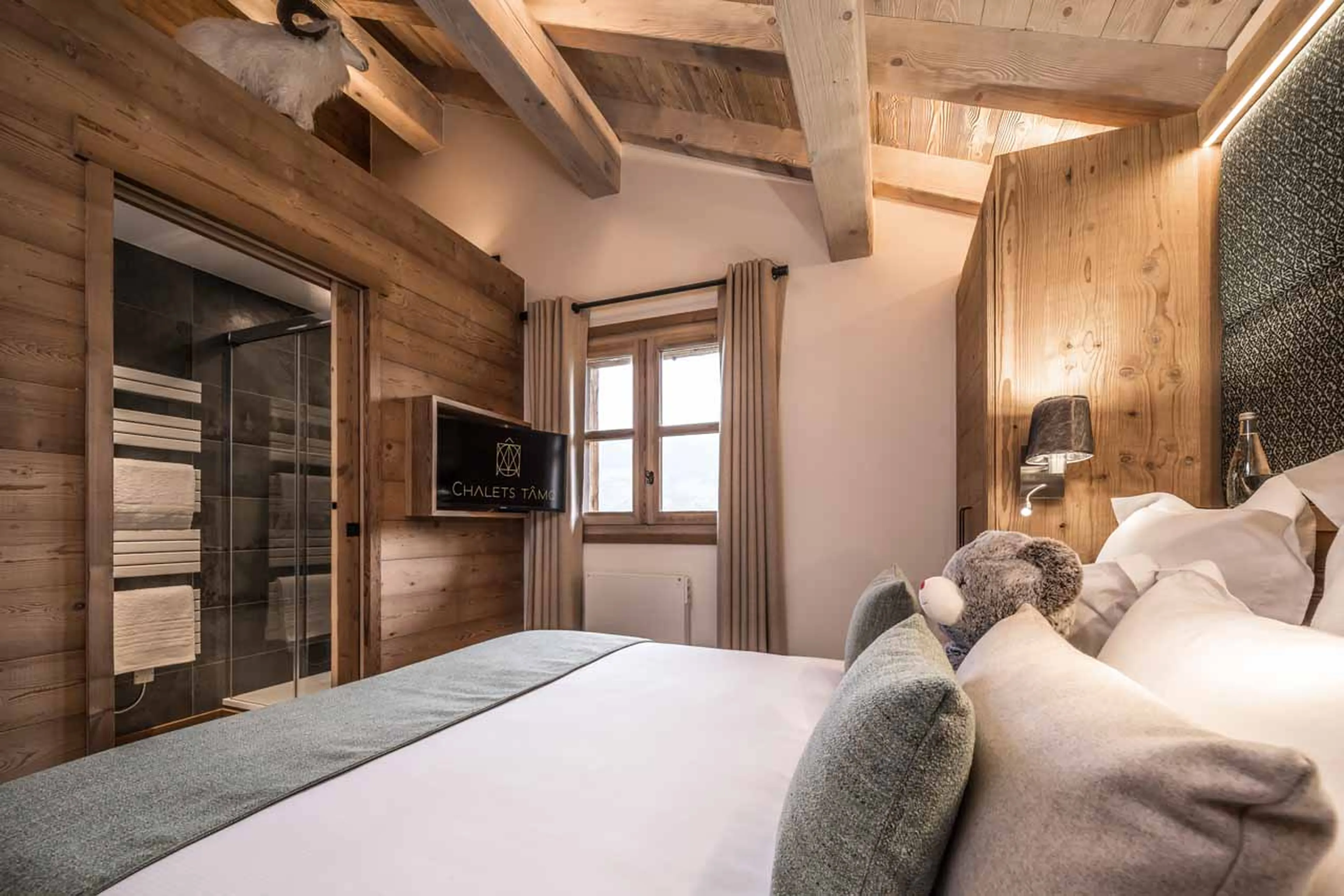 TV in bedroom at Chalet Le 1946 in Courchevel Le Praz