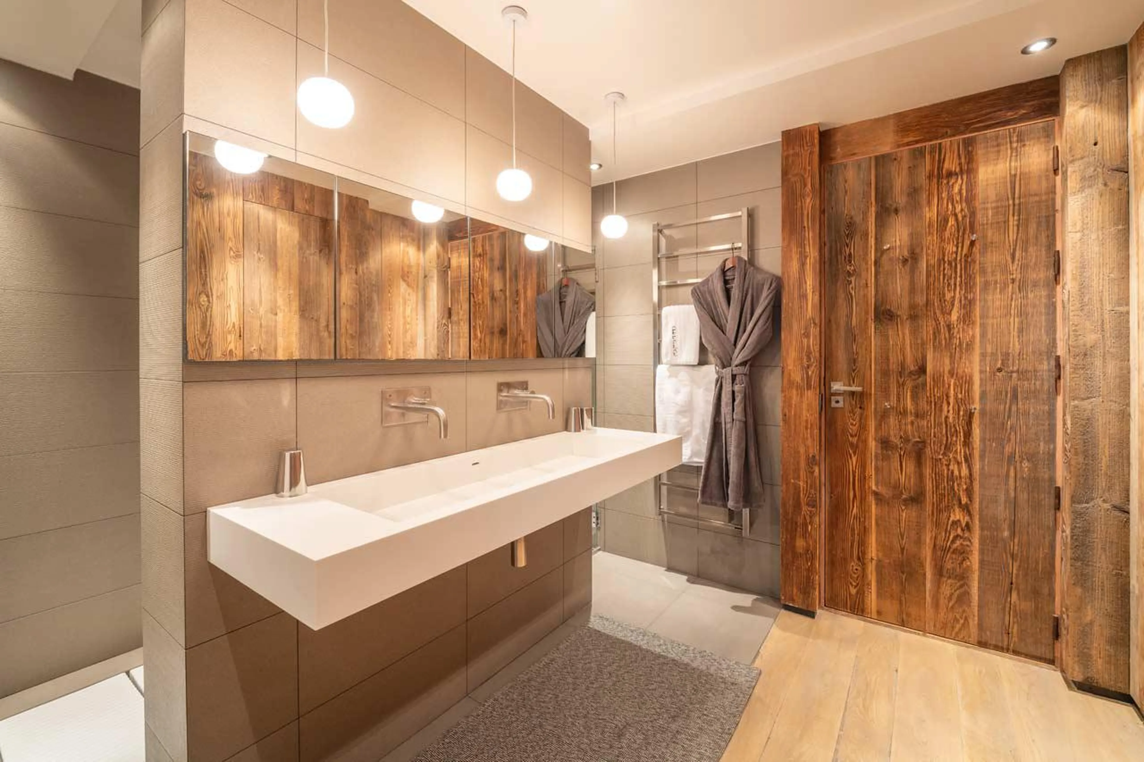 En-suite shower room with double basin at Le Grand Cerf in Meribel