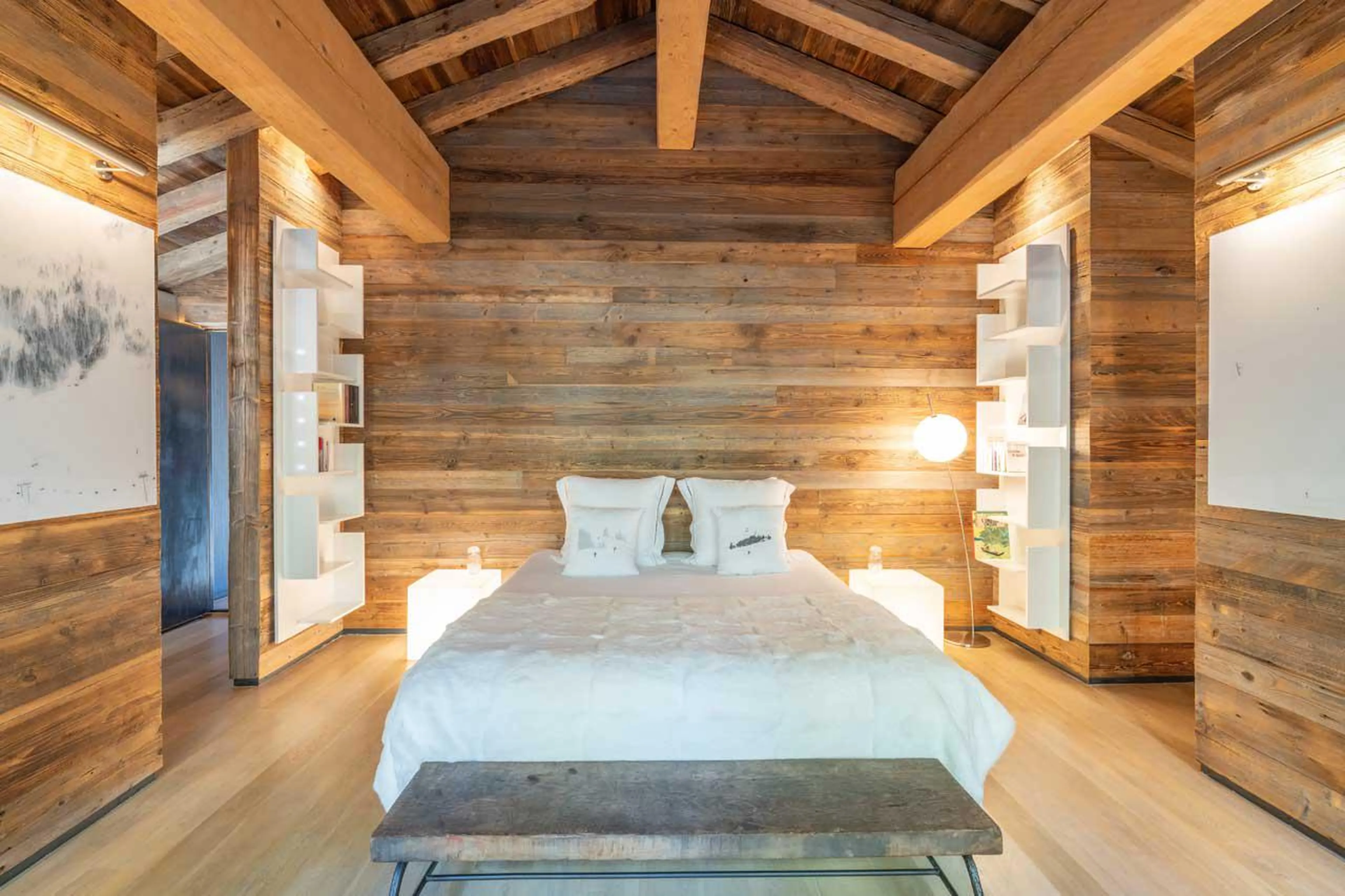 Double bedroom with beautiful wooden beamed ceiling at Le Grand Cerf in Meribel