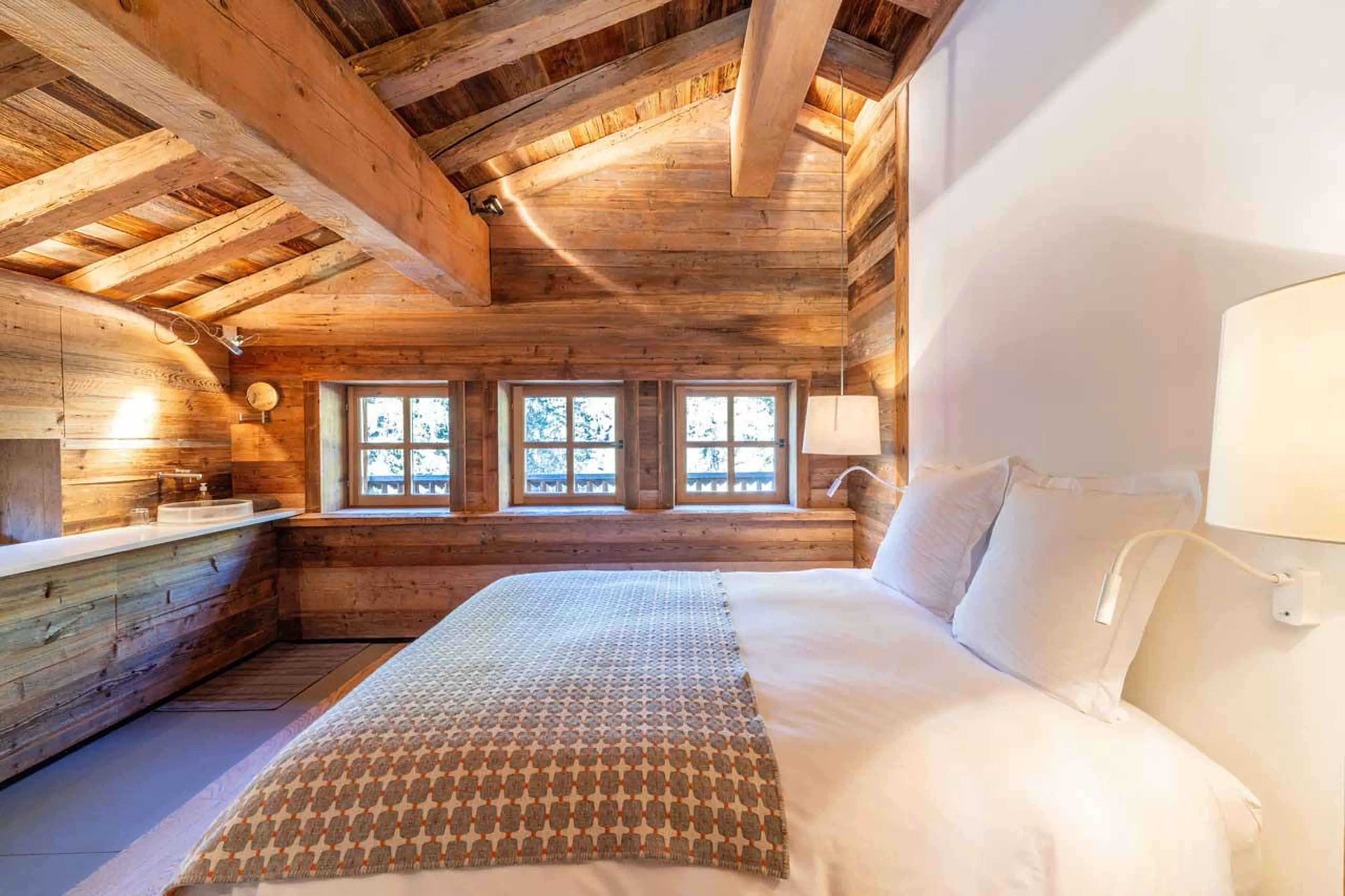 Double bedroom with en-suite shower room at Le Grand Cerf in Meribel