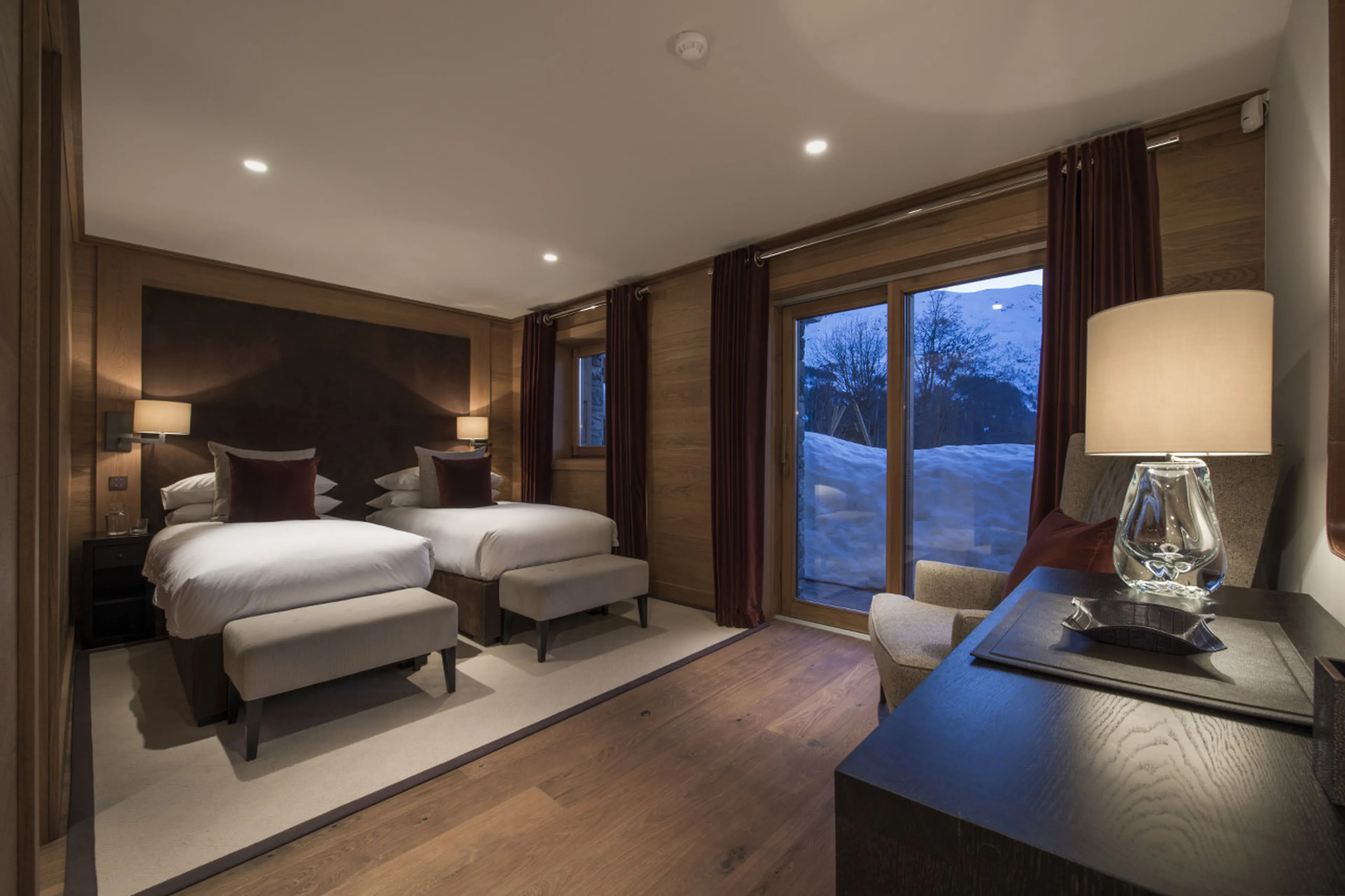 Bedroom with double/twin beds, open to terrace of Chalet Le Grenier in Meribel