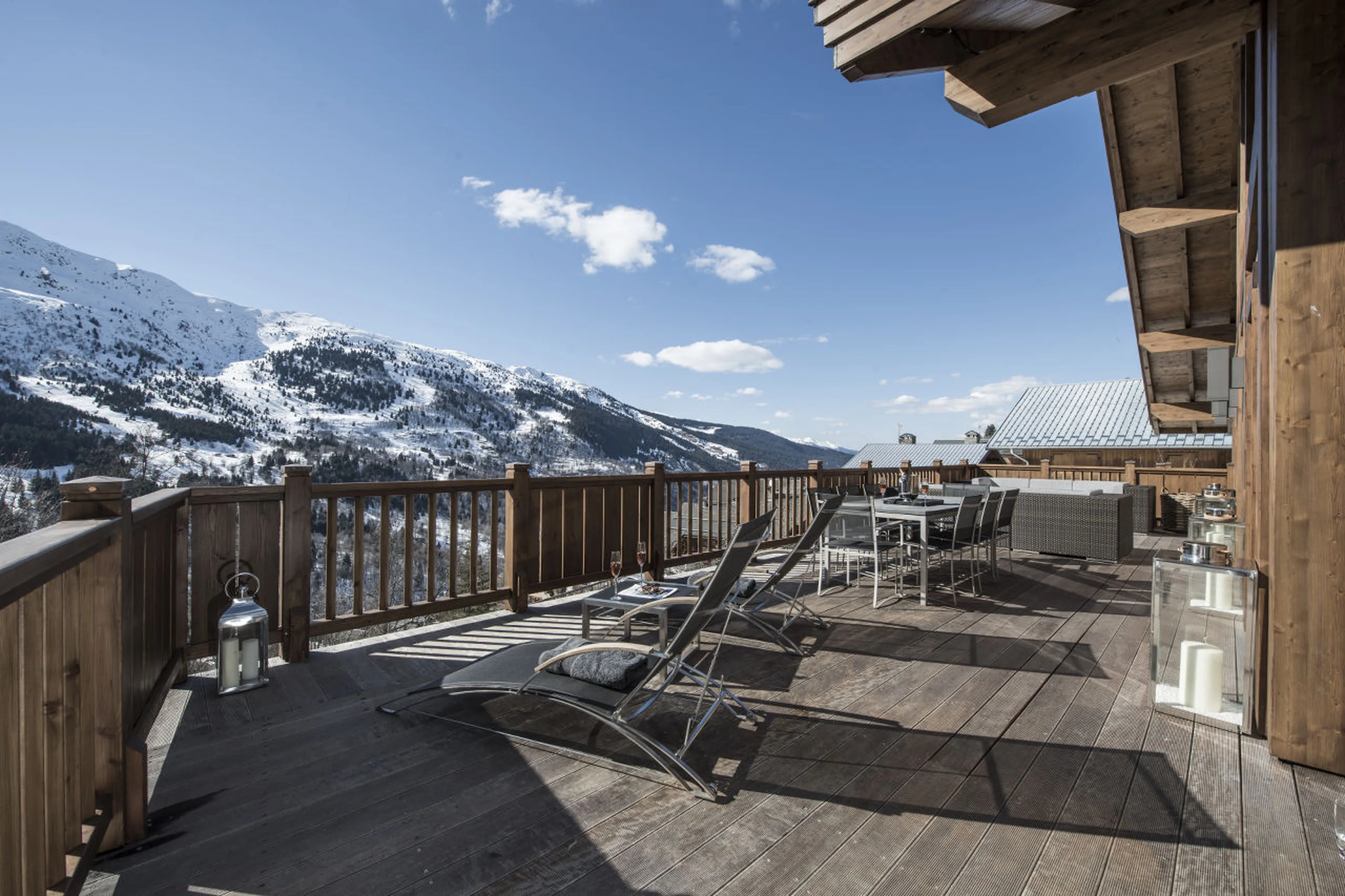 Large outdoor terrace of Chalet Le Grenier, overlooking the mountains of Meribel