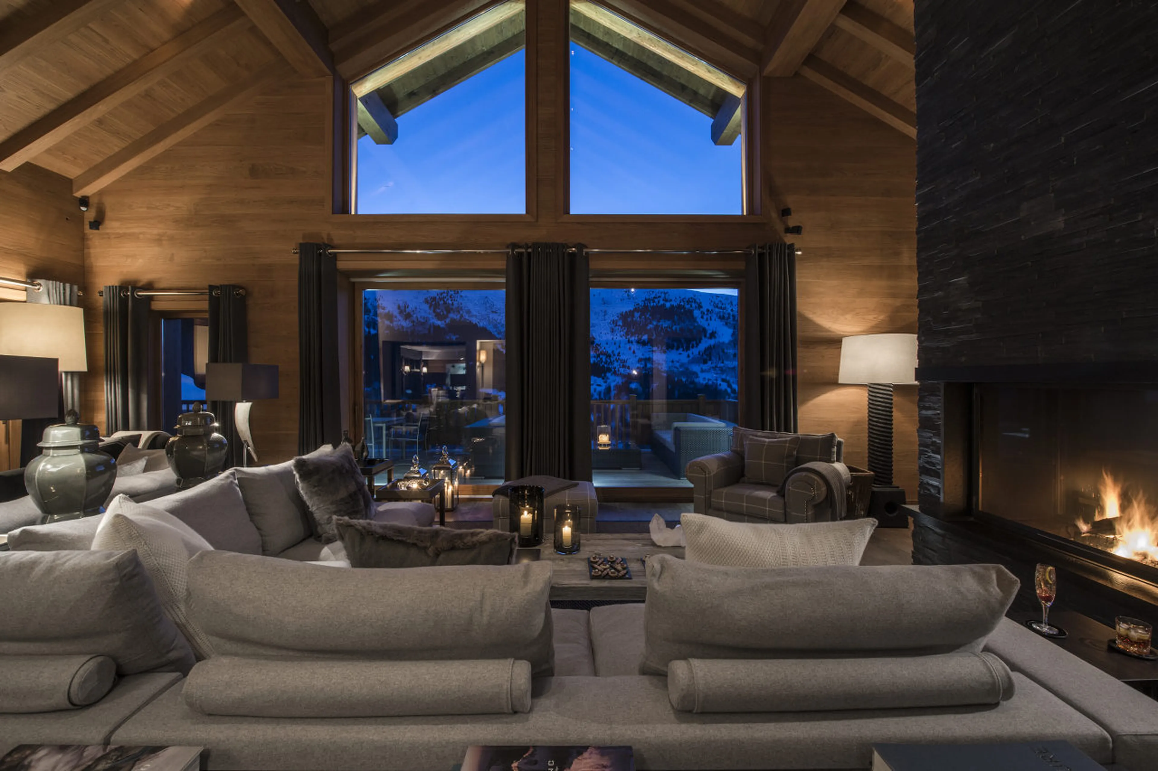 Living area with fireplace in Chalet Le Grenier in Meribel