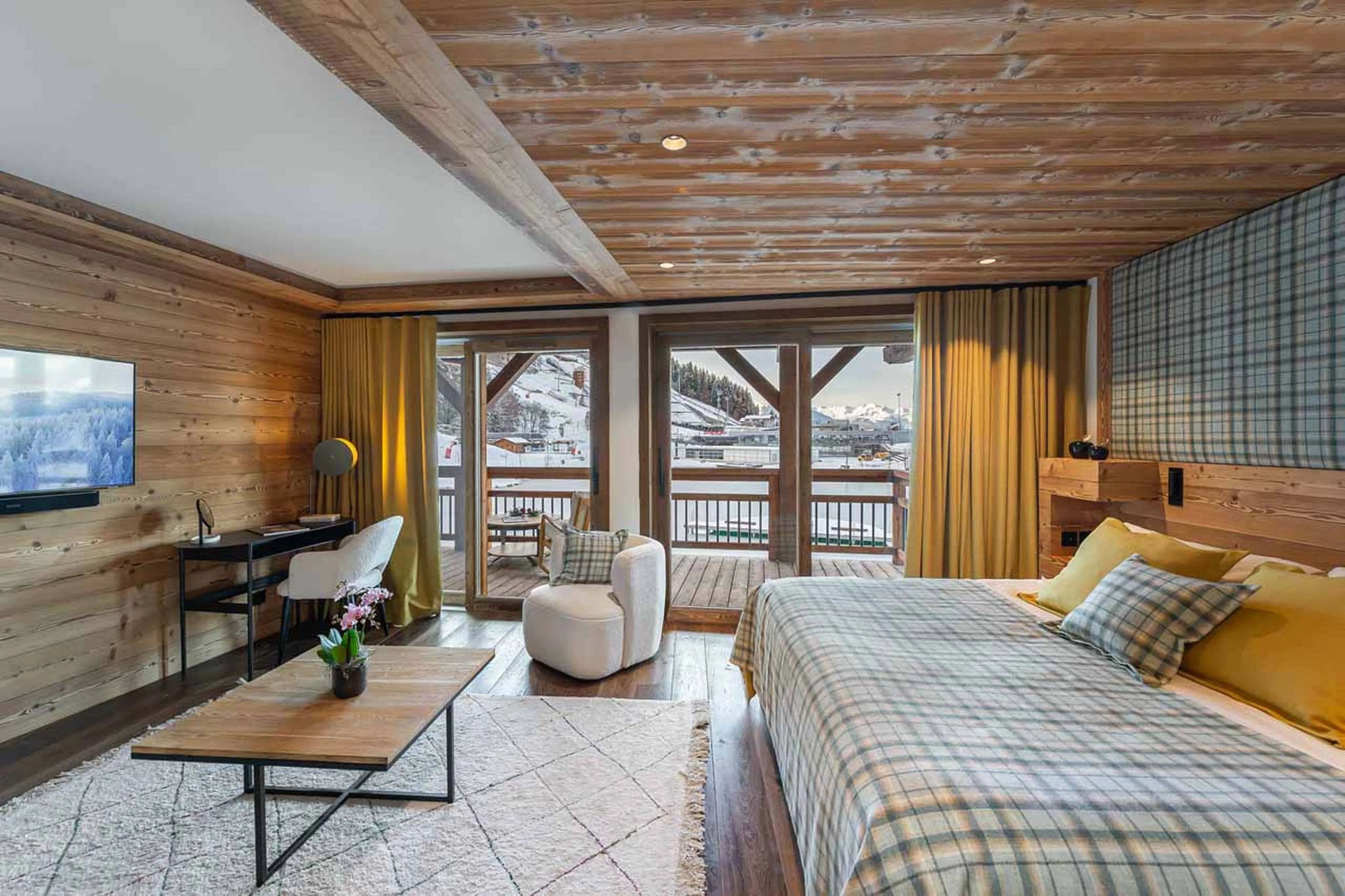 TV in double bedroom at Chalet Le Moulin in Courchevel Le Praz