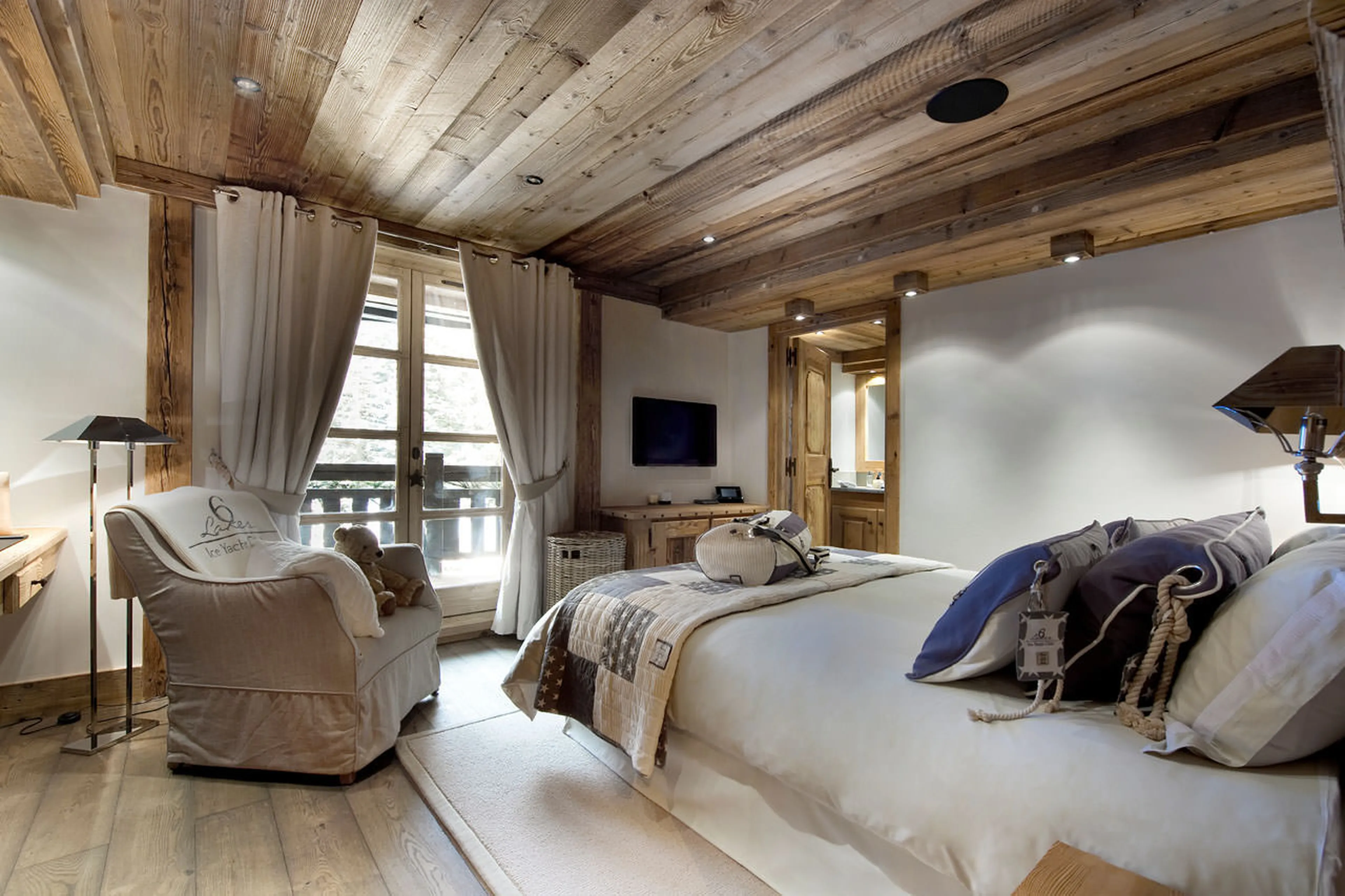 King size bedroom suite with balcony access in Chalet Le Petit Chateau in Courchevel 1850
