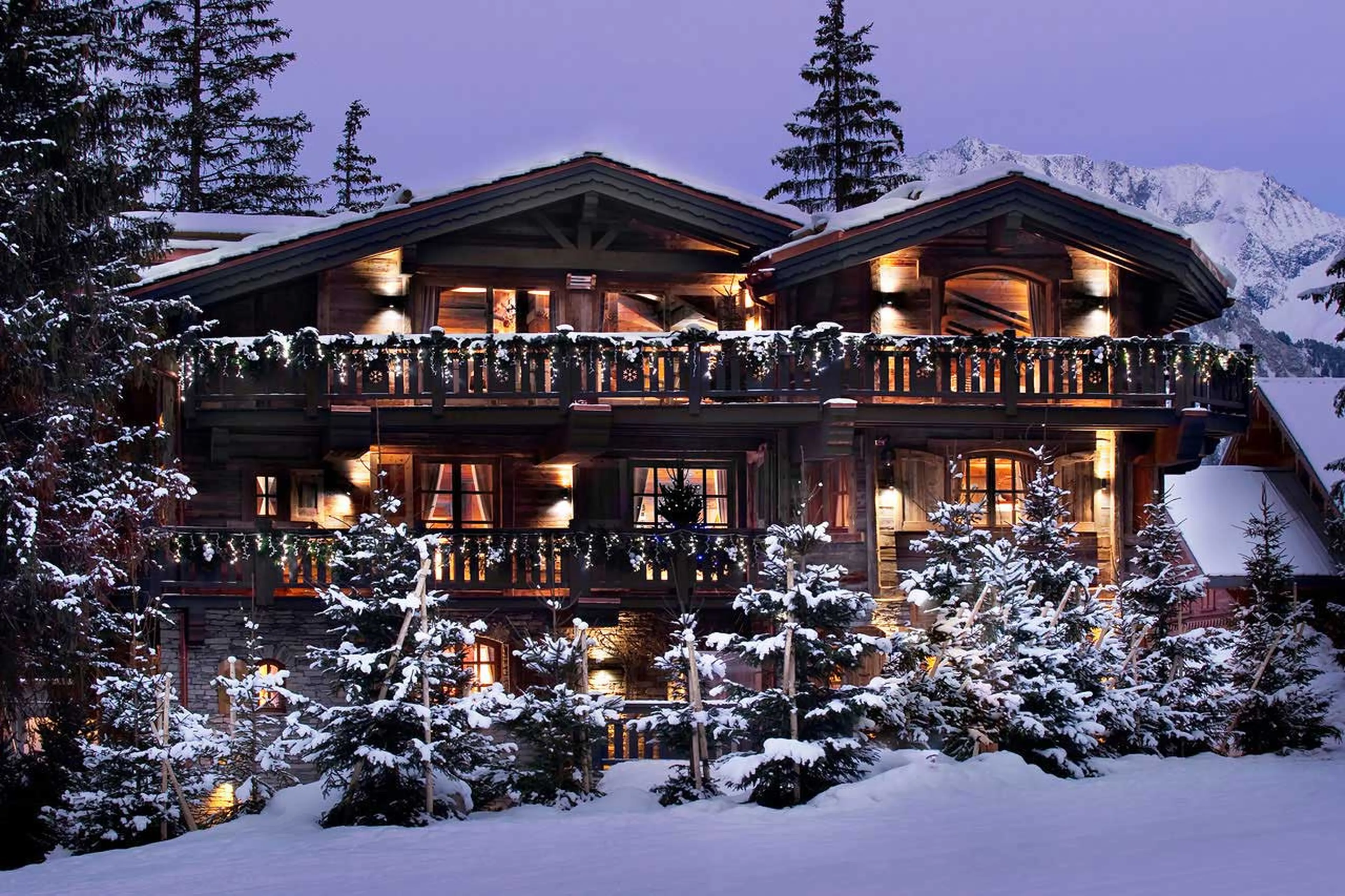 Romantic night time view of Chalet Le Petit Chateau in Courchevel 1850