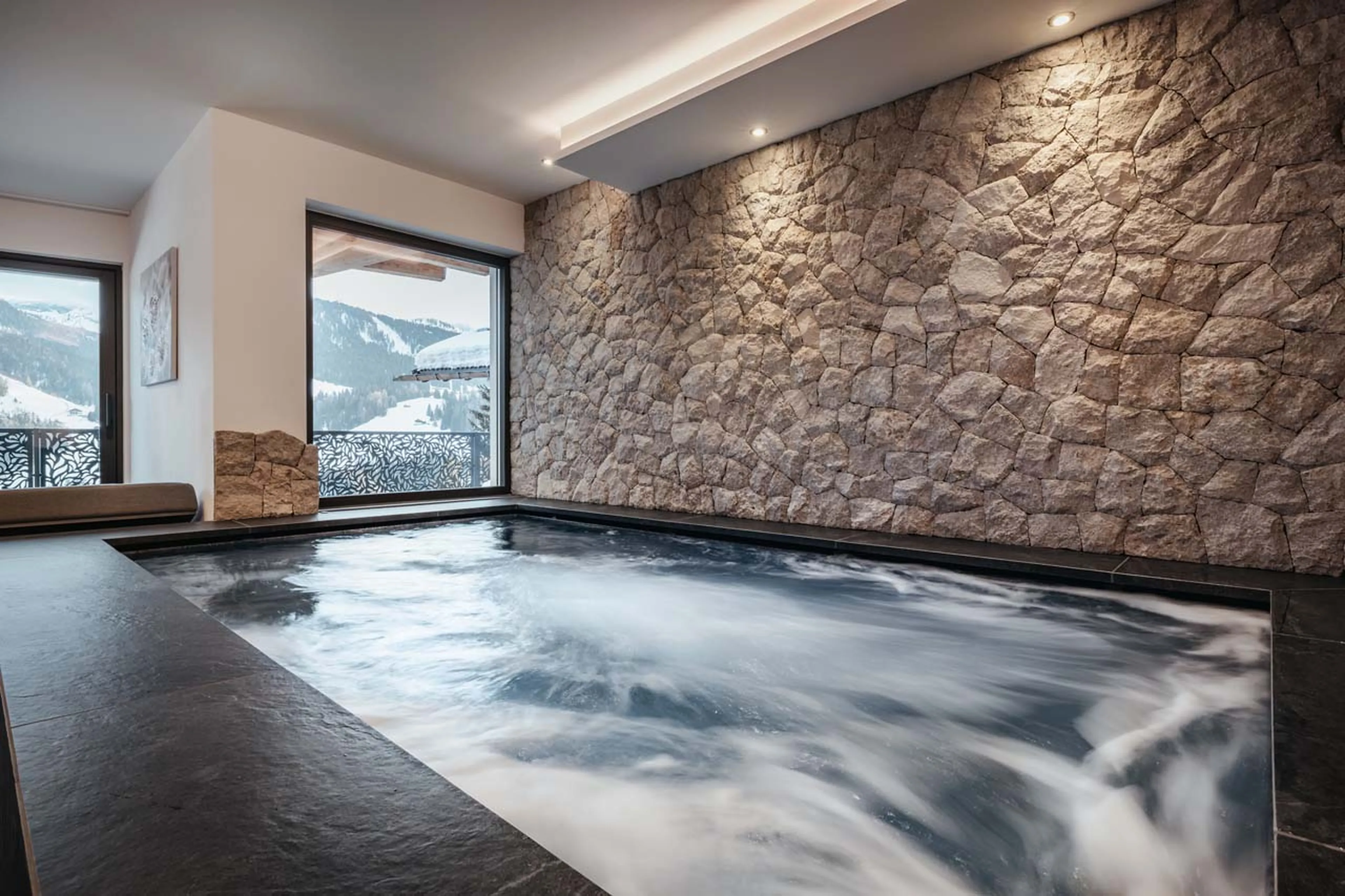 Hot tub with mountain views in Chalet Lefiro, Val Gardena