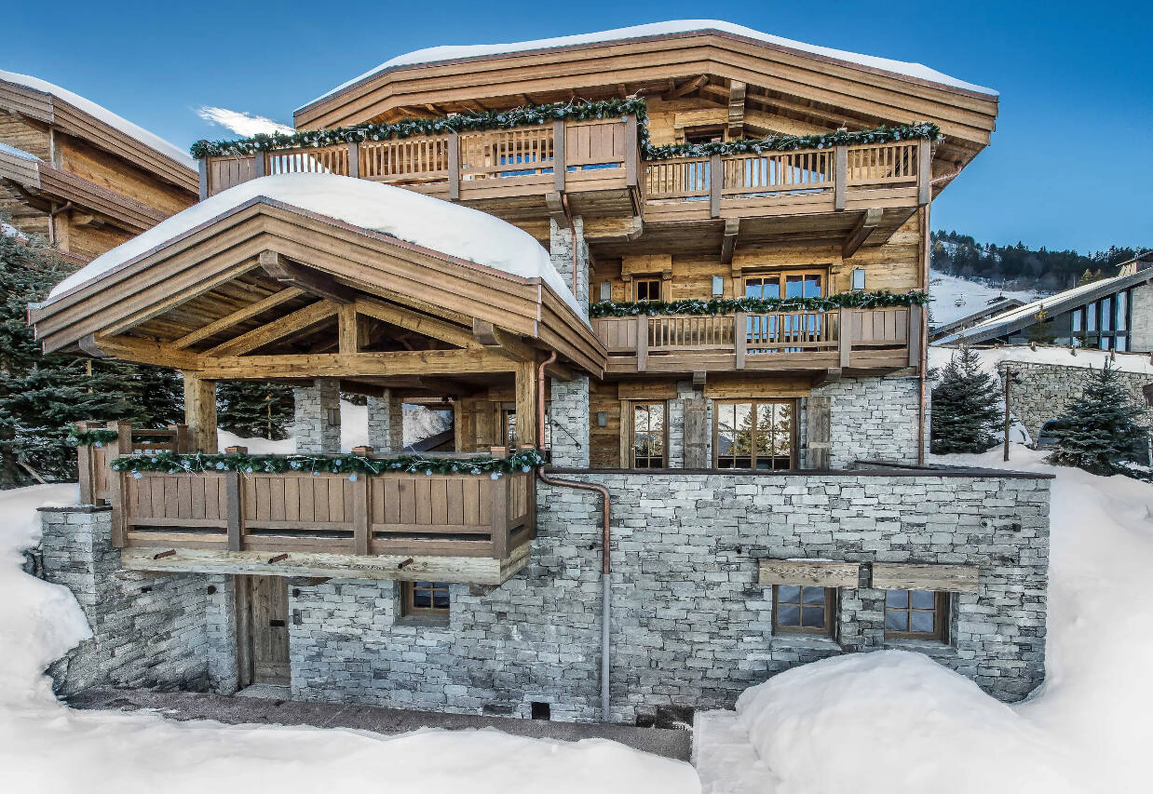Stone and wood façade of Chalet Les Bastidons  in Courchevel 1850