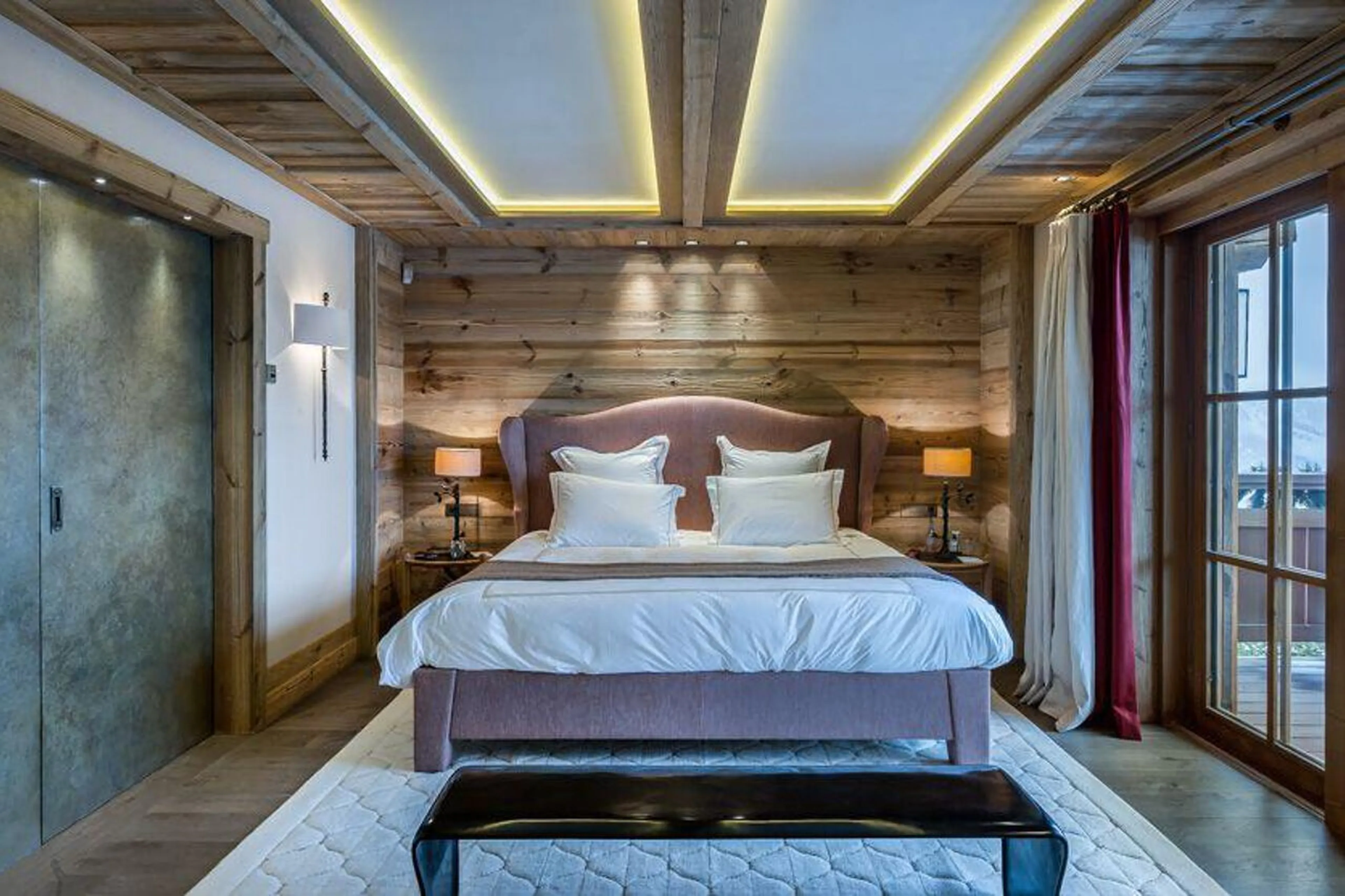 Master bedroom suite with balcony access in Chalet Les Bastidons in Courchevel 1850