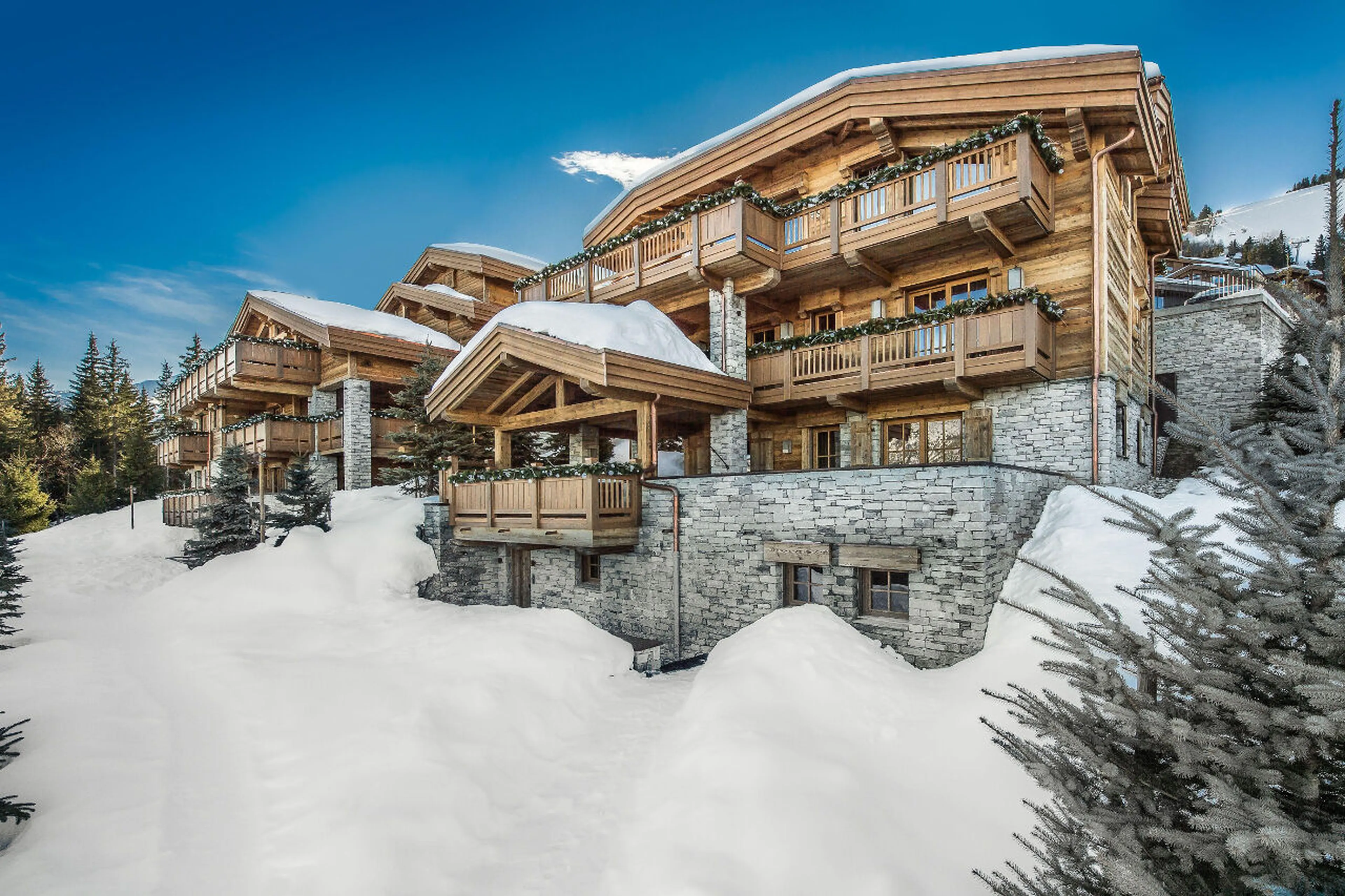 Chalet Les Bastidons and chalet Cryst'Aile on the left in Courchevel 1850