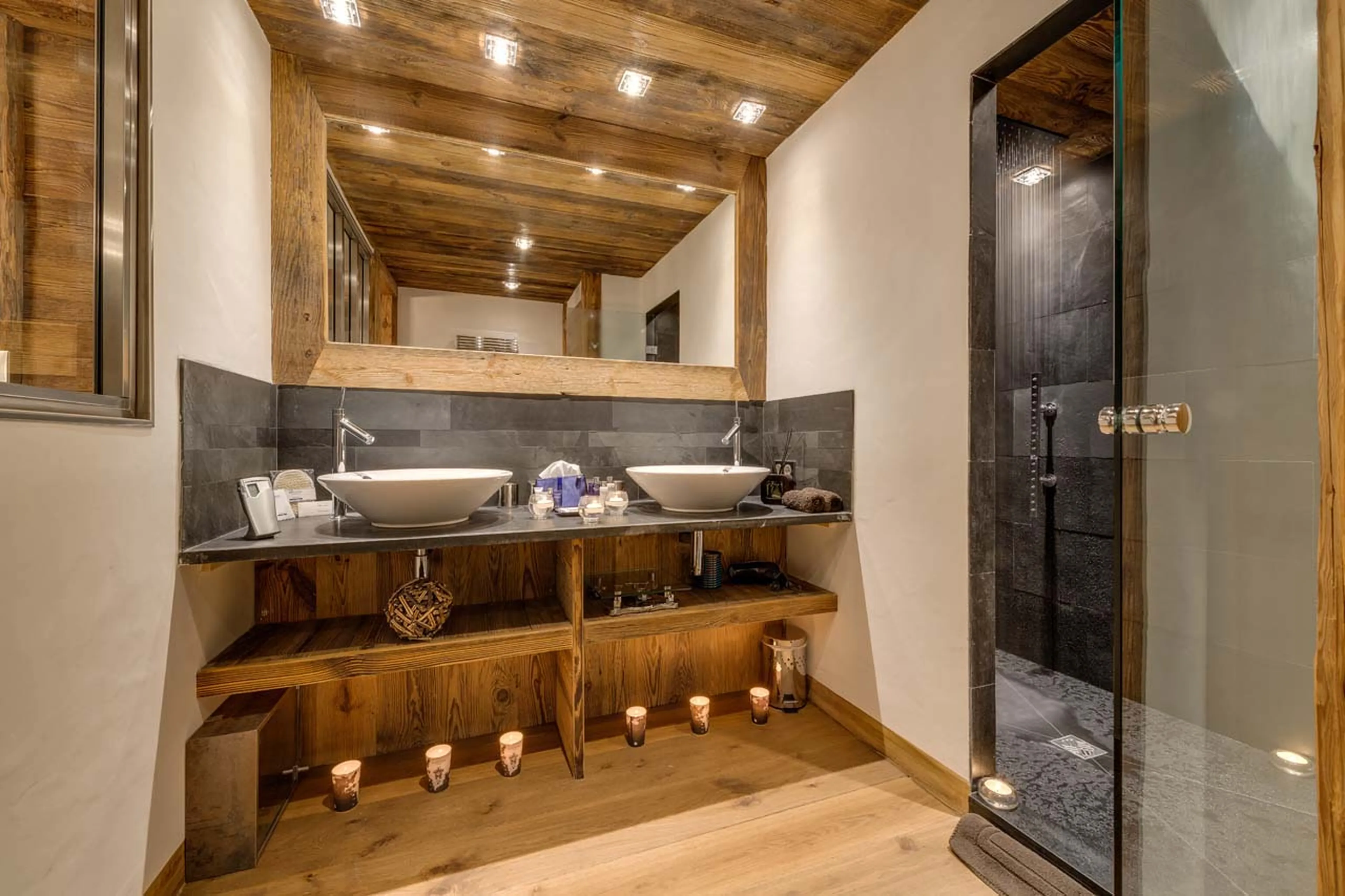 Shower room en suite to double bedroom has double basins in Chalet Lhotse in Val d’ Isere