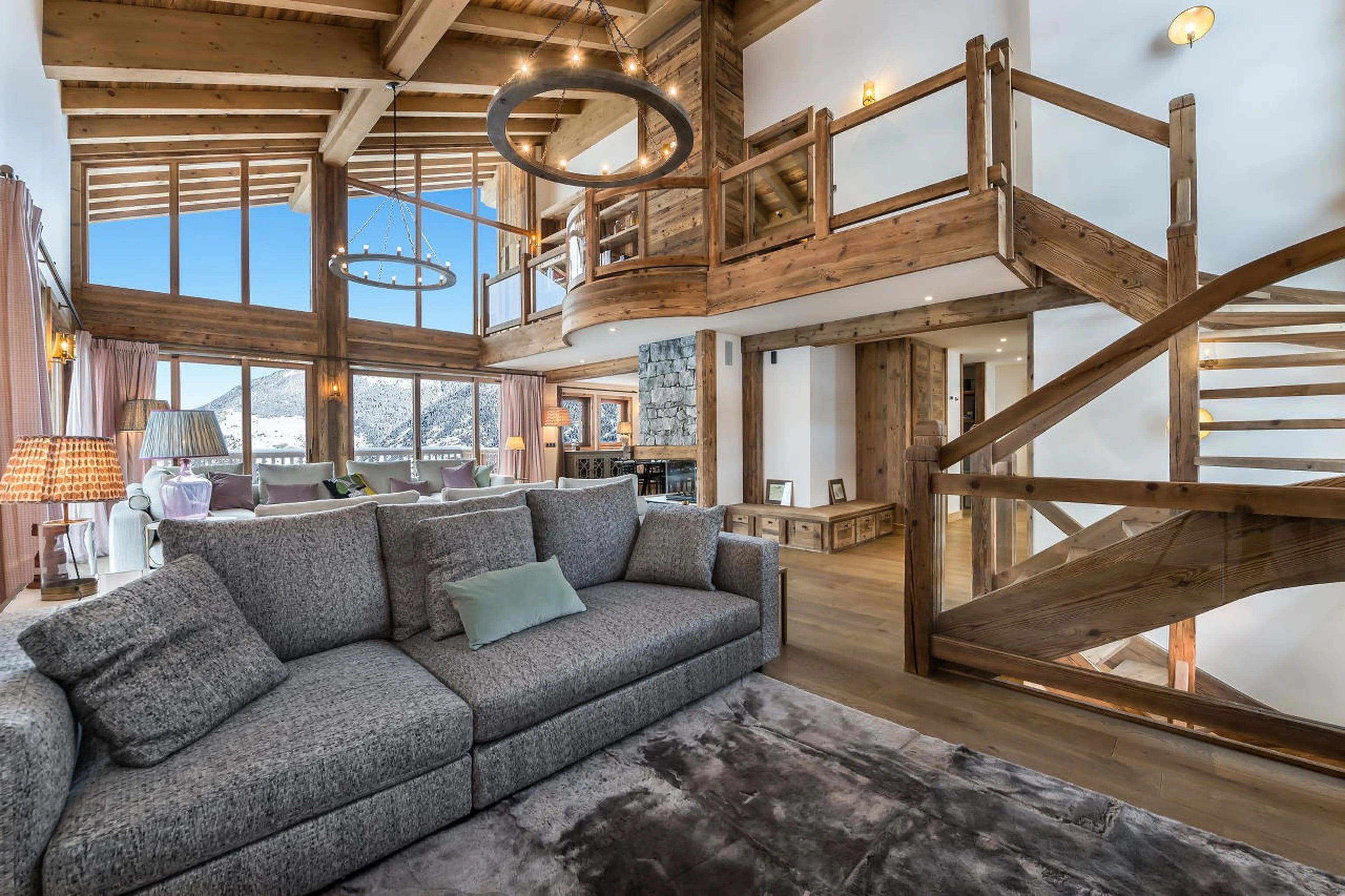Old wood and high quality textiles in lounge area of Chalet Libellule in Courchevel 1650