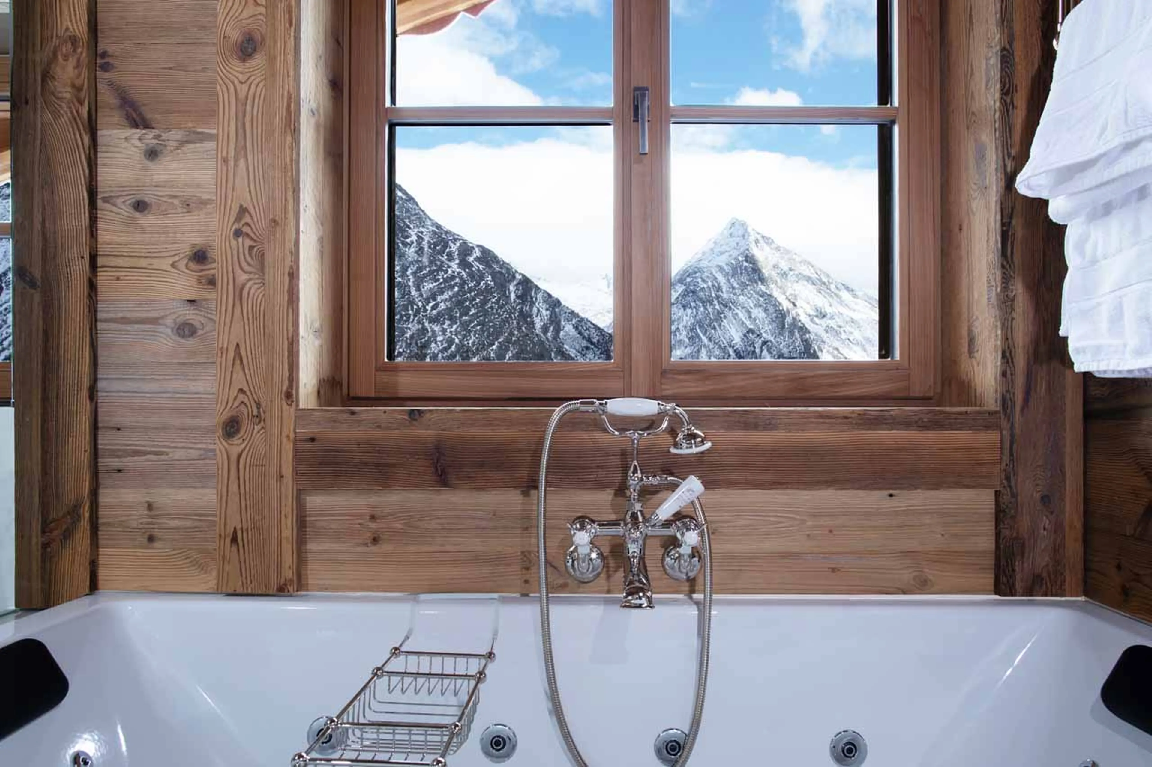 Mountain views from bathtub at Chalet Lycka in Saas Fee
