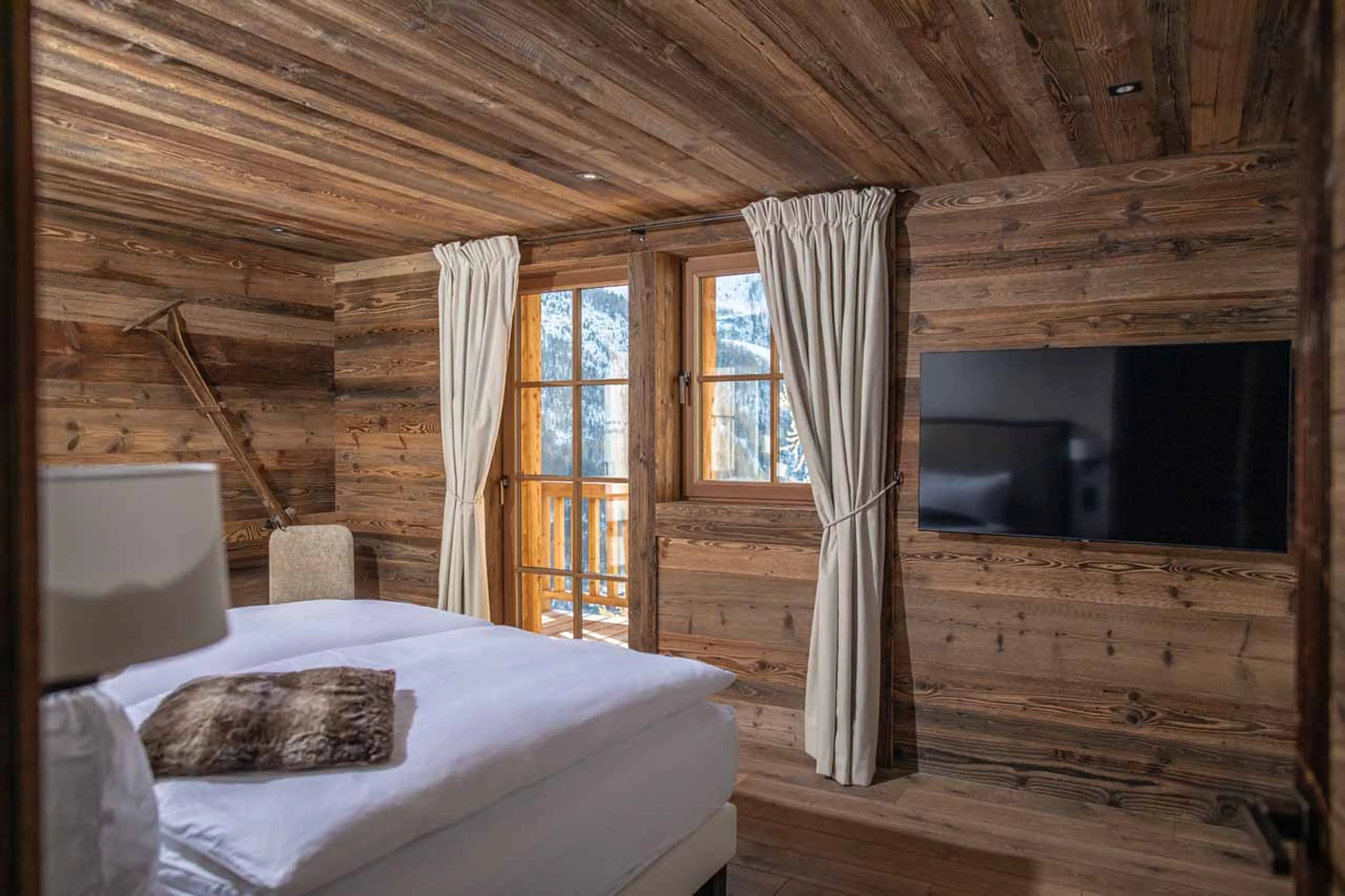 Balcony access from bedroom two at Chalet Lycka in Saas Fee
