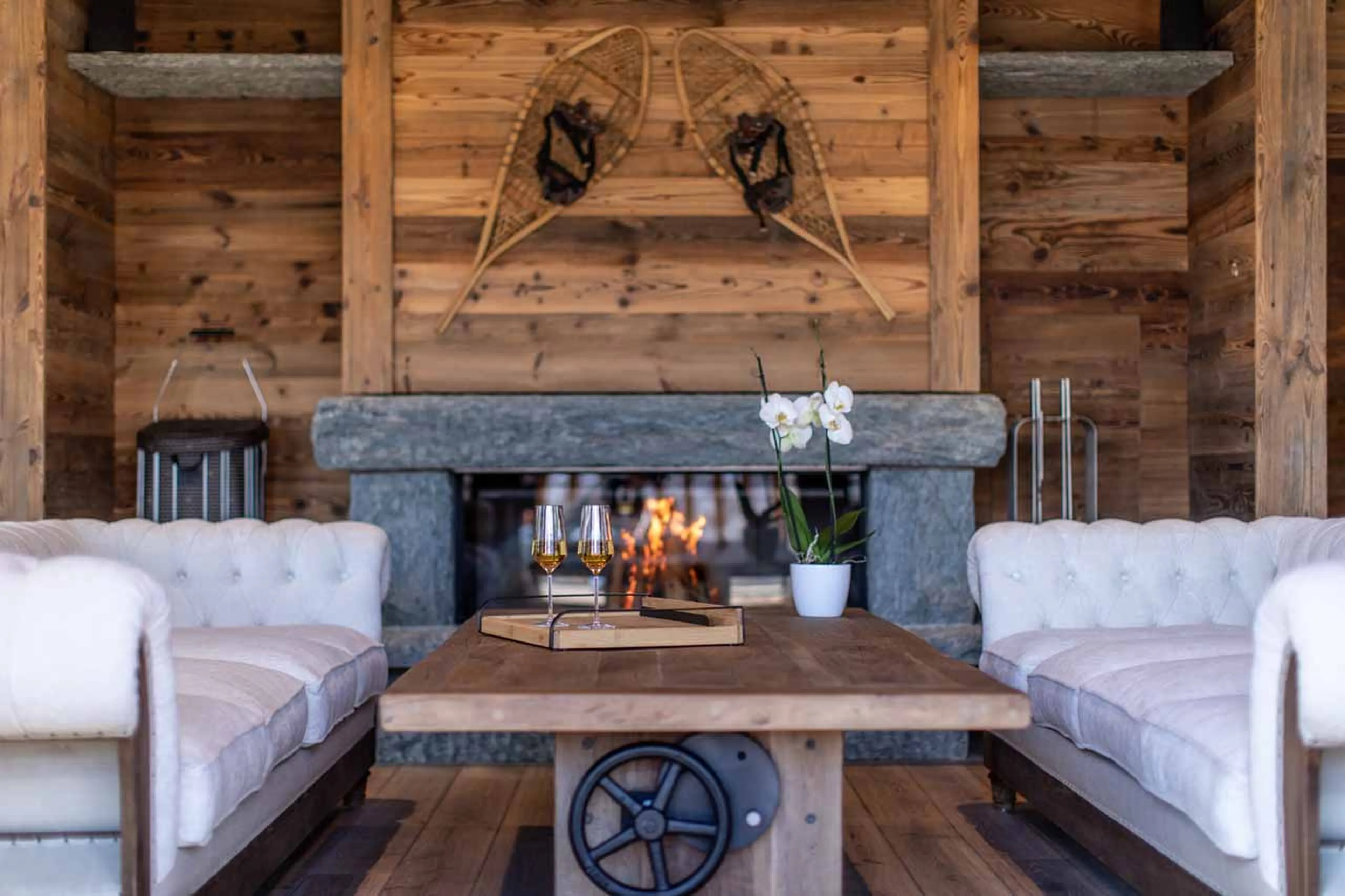 Fireplace in living room of Chalet Lycka in Saas Fee